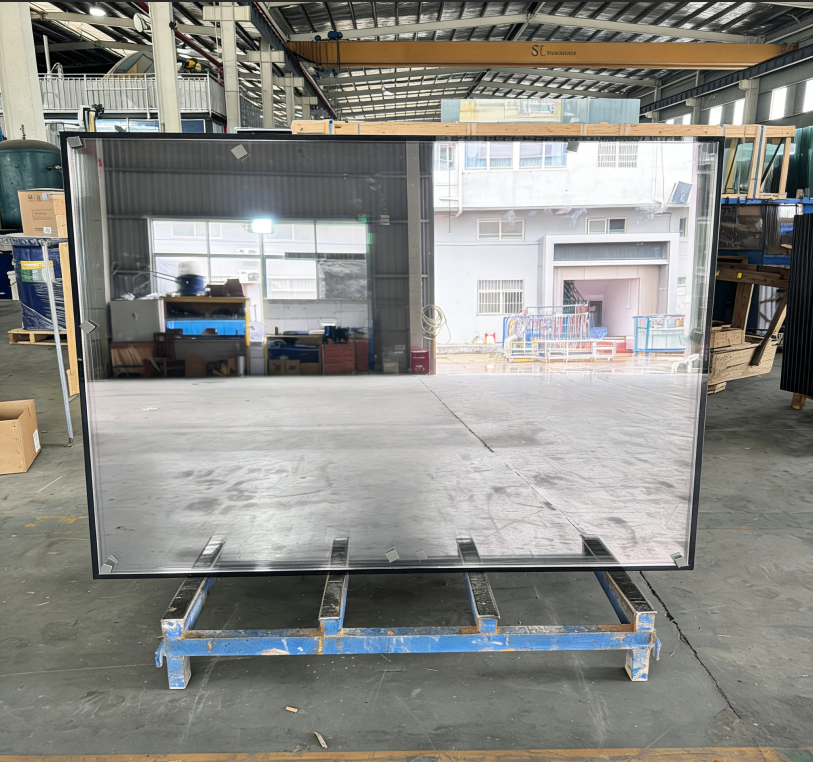 Insulating glass unit with sealed cavity and spacer