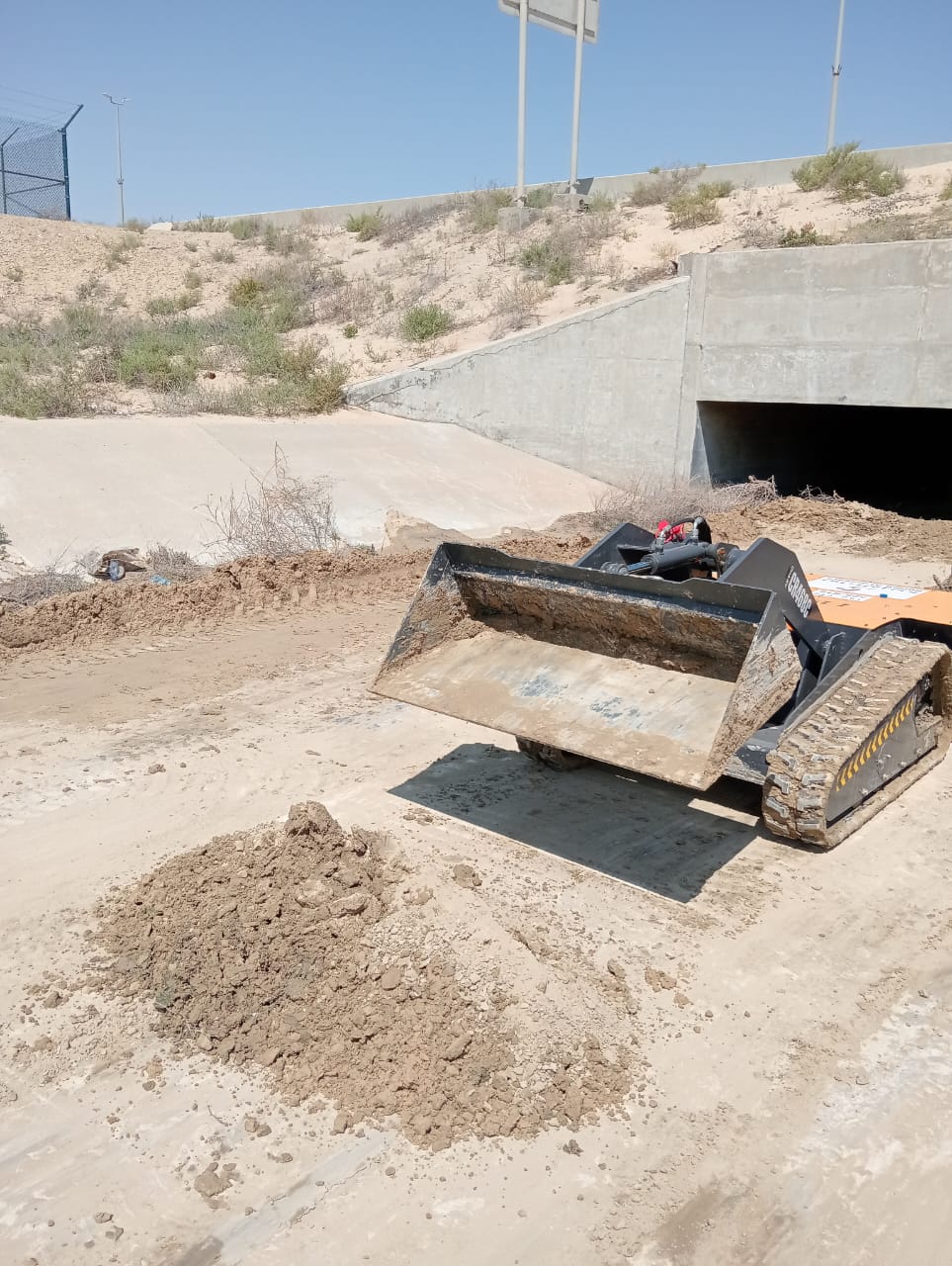 CHARY minidozer used in a narrow underground tunnel cleaning operation
