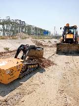 Minidozer operating in confined industrial environment