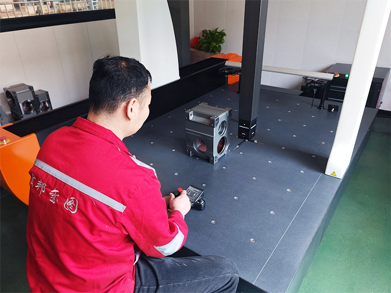 Technician performing three-coordinate box installation accuracy quality inspection on a cam indexer at HONEPAN factory