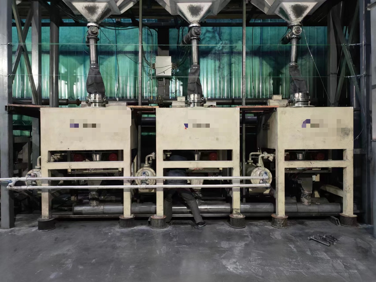 Industrial magnetic separators installed on a bulk material handling line in a heavy industry plant