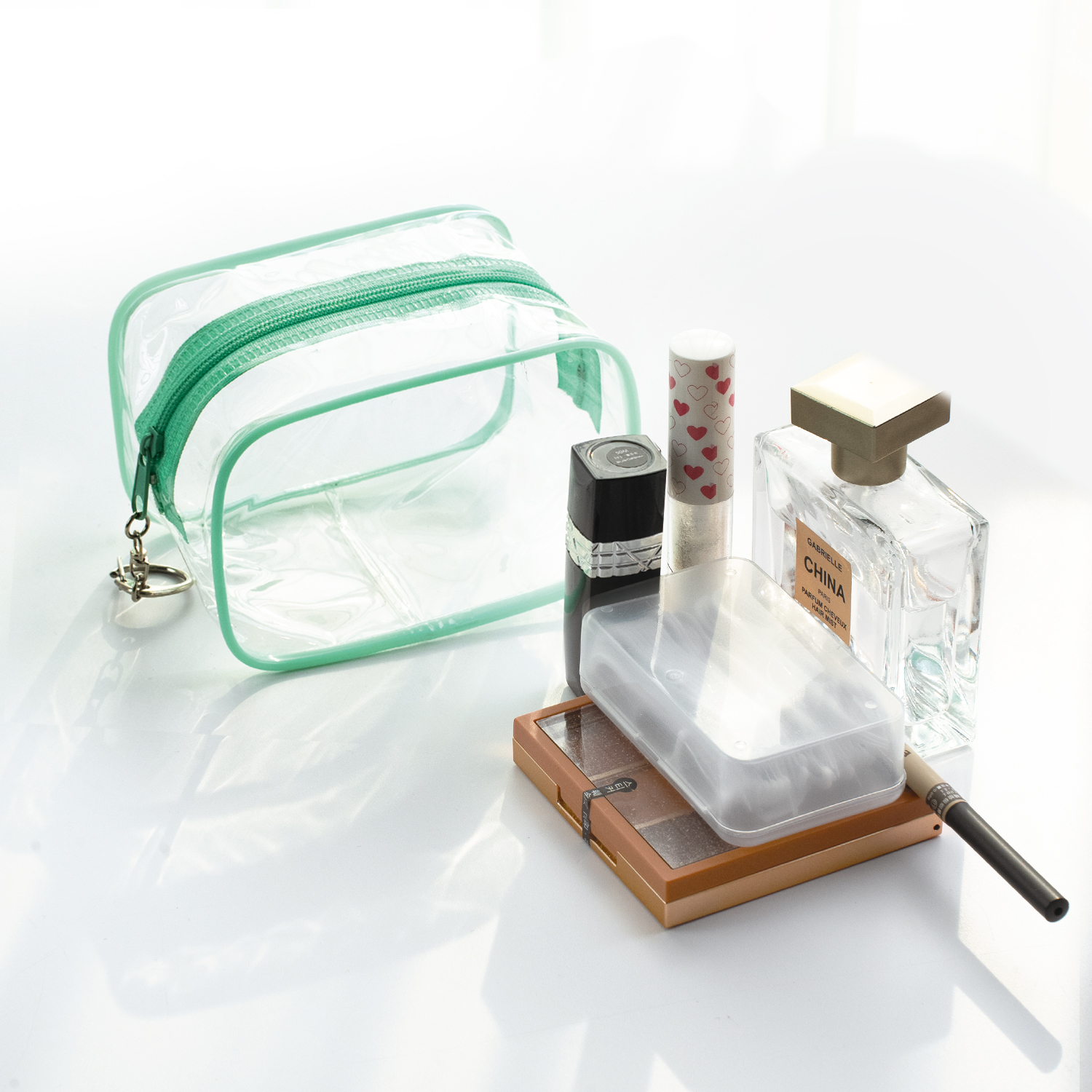 Mint green transparent PVC cosmetic bag empty and clear for storage
