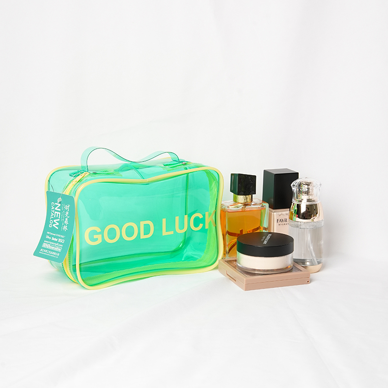 Green PVC cosmetic bag with accessories for promotional display