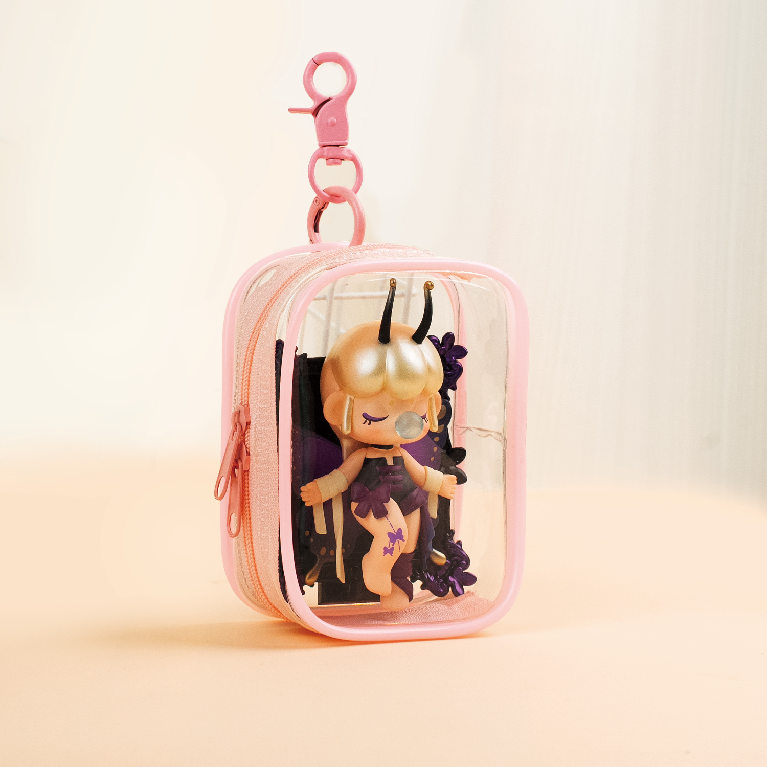 Pink PVC display bag with doll, portable keychain design