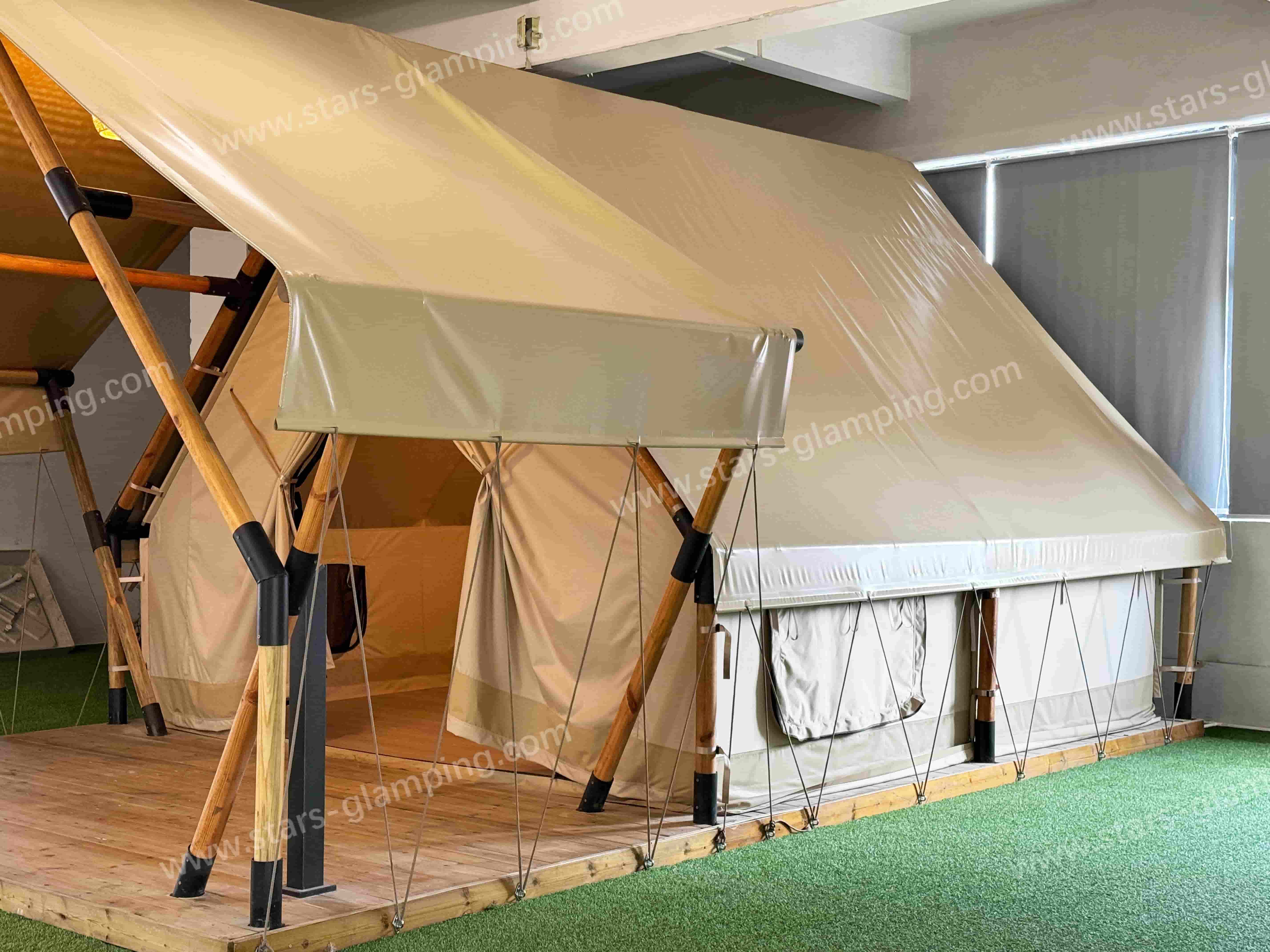 Stars Glamping safari tent model Vega in an open grassland setting, designed for luxury wildlife lodges