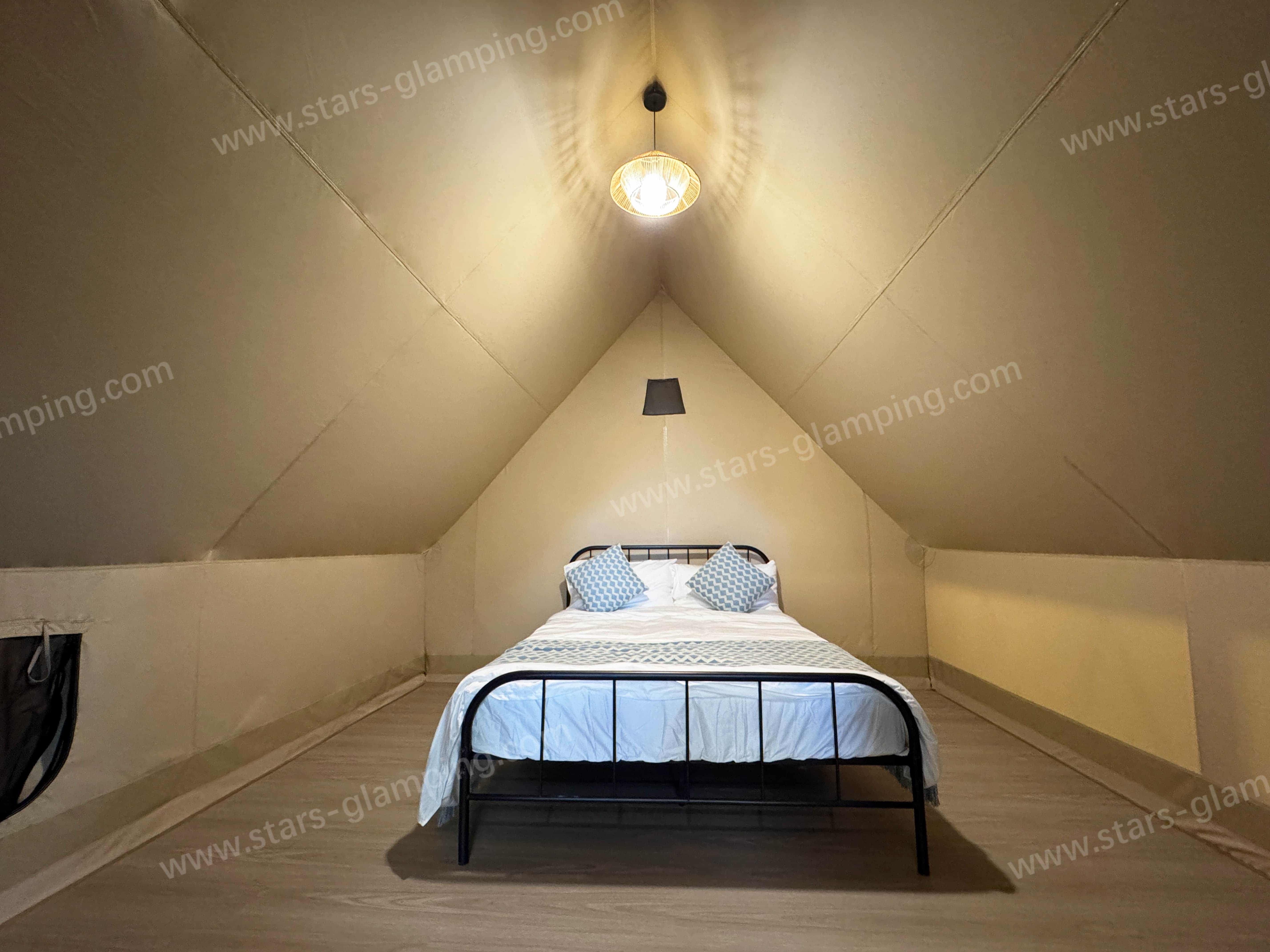 Vega safari tent installed at a glamping campsite with wooden deck