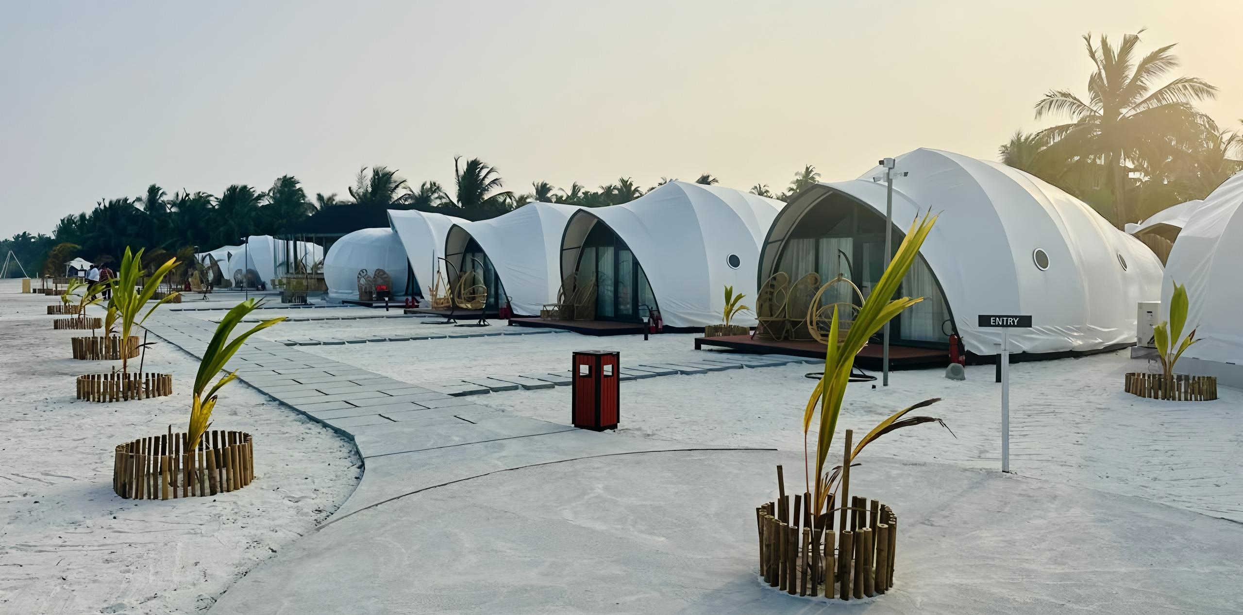 Luxury hotel tent in a scenic mountain resort setting, showcasing eco-friendly glamping accommodation