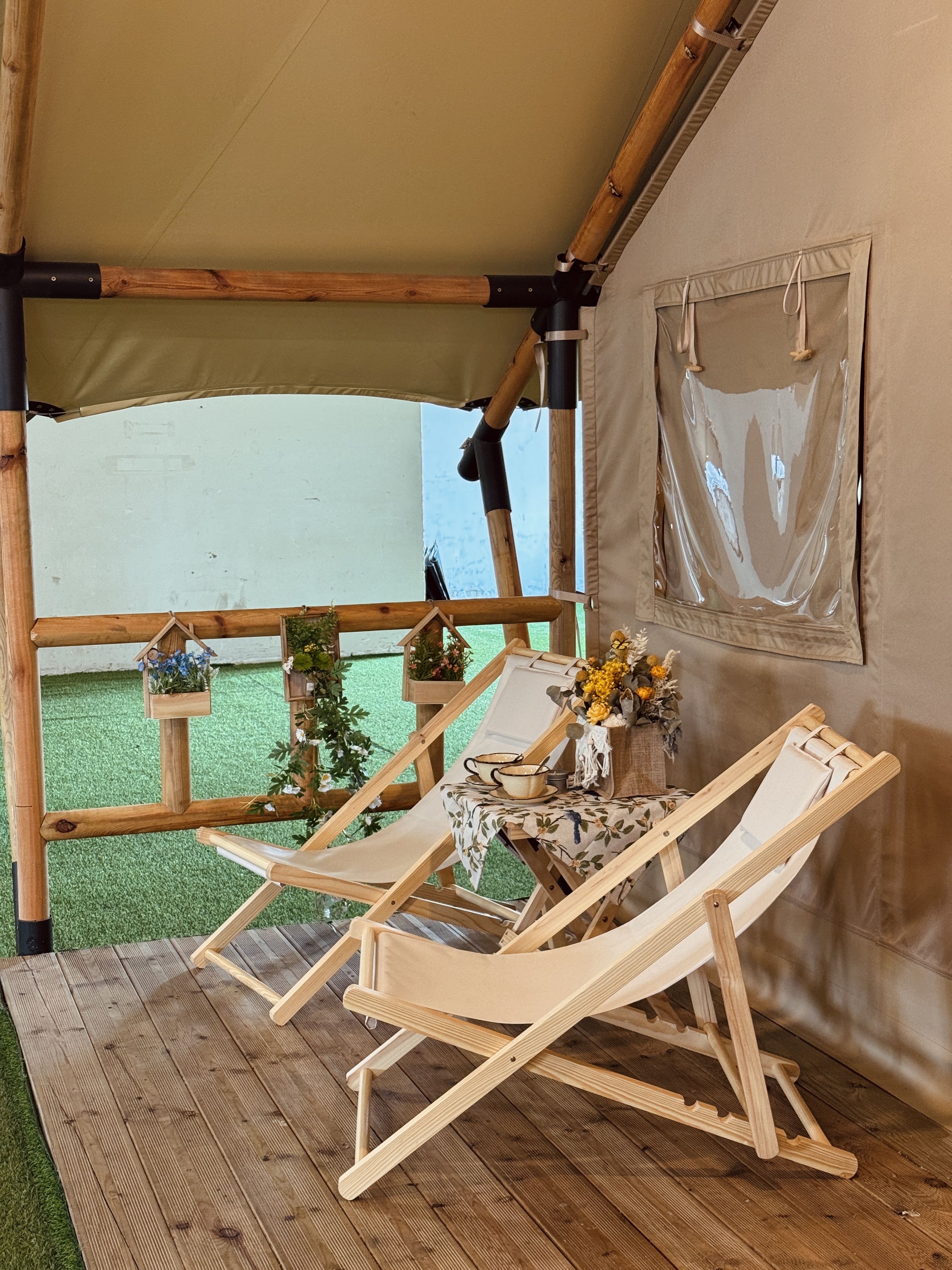 Safari Tent Epic model with wood frame and large windows in a forest setting