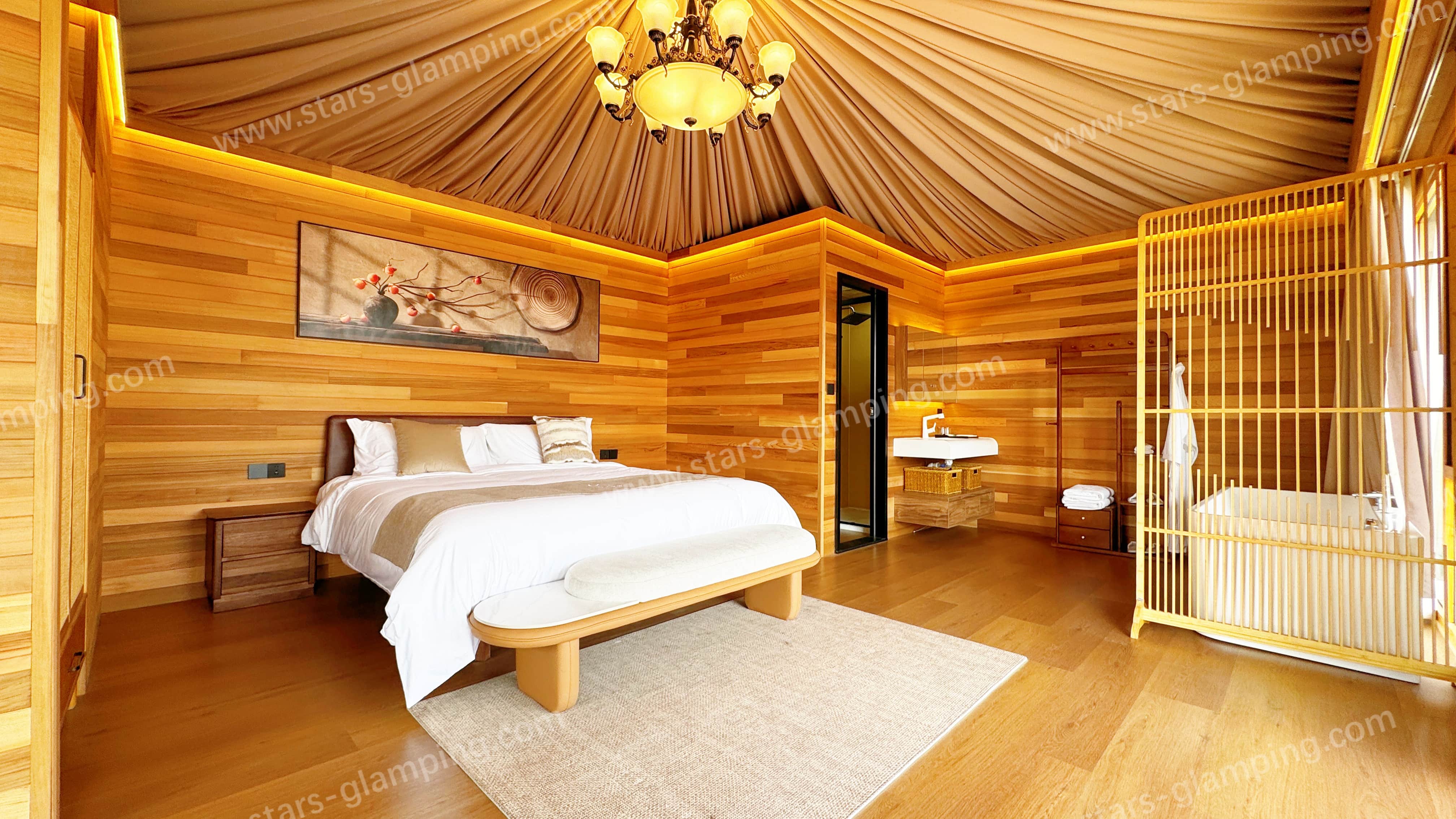 Luxury hotel tent Tethys model installed in a desert resort setting with panoramic glass walls