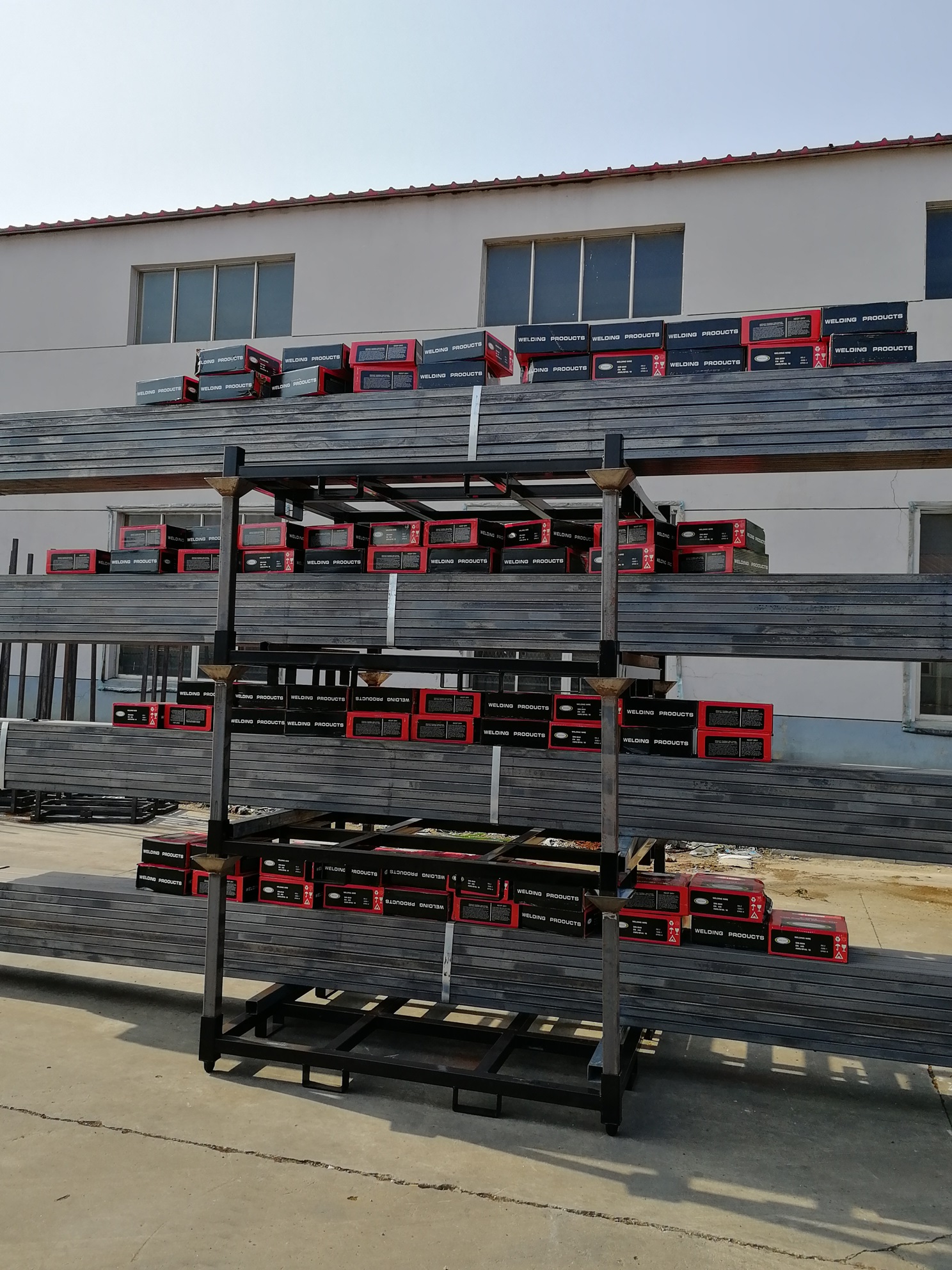 Stackable steel storage rack under a stacking and loading test