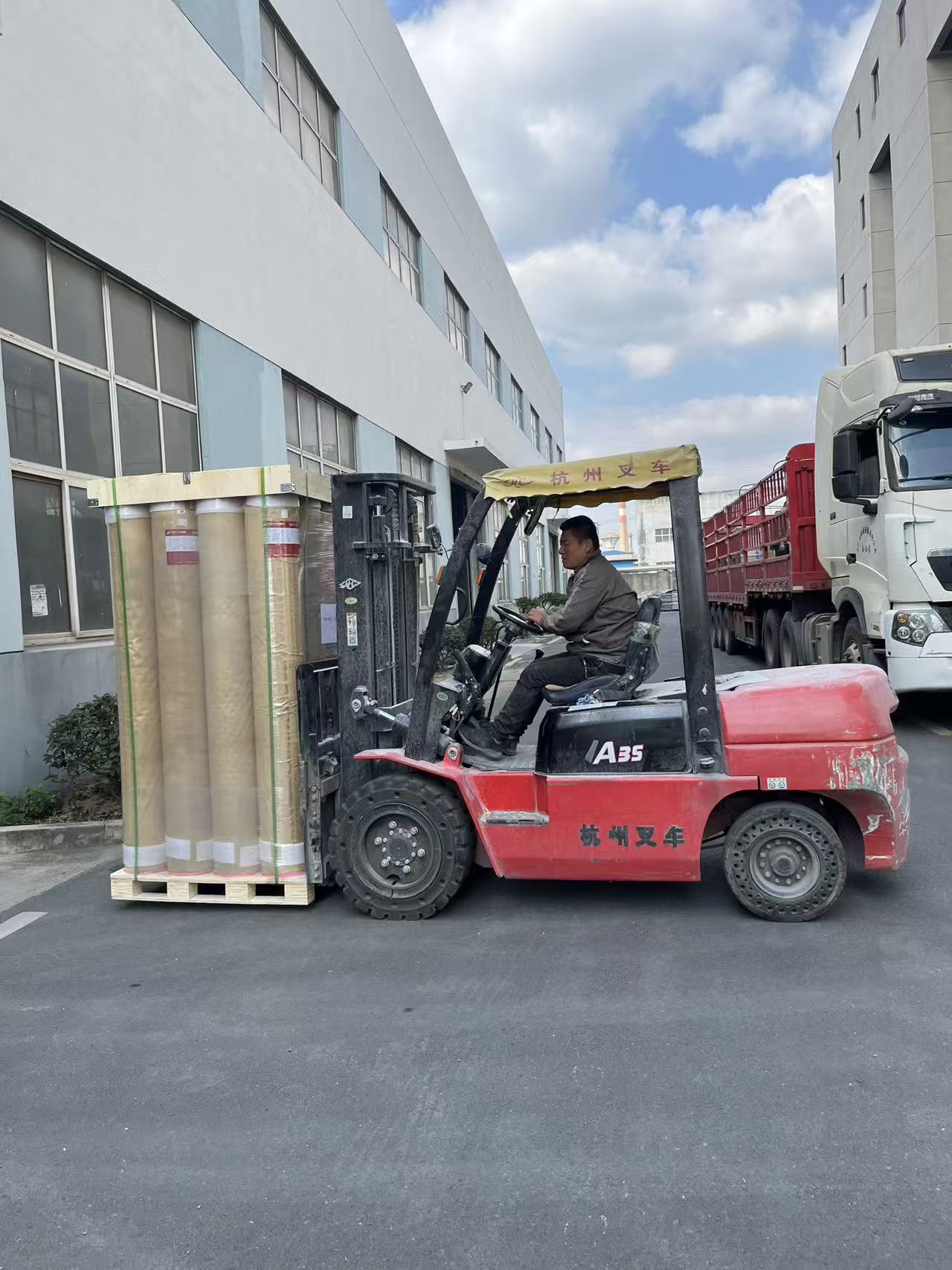 Inspection and packing of commercial PVC flooring rolls ready for container loading