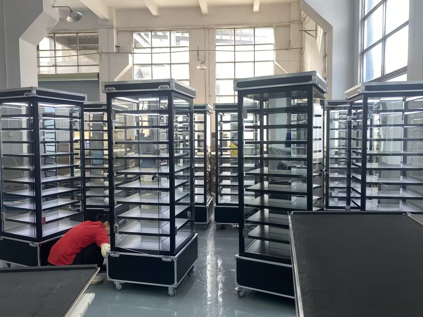 Assembly line at ECO DDL factory showing quality assembly process for display fixtures