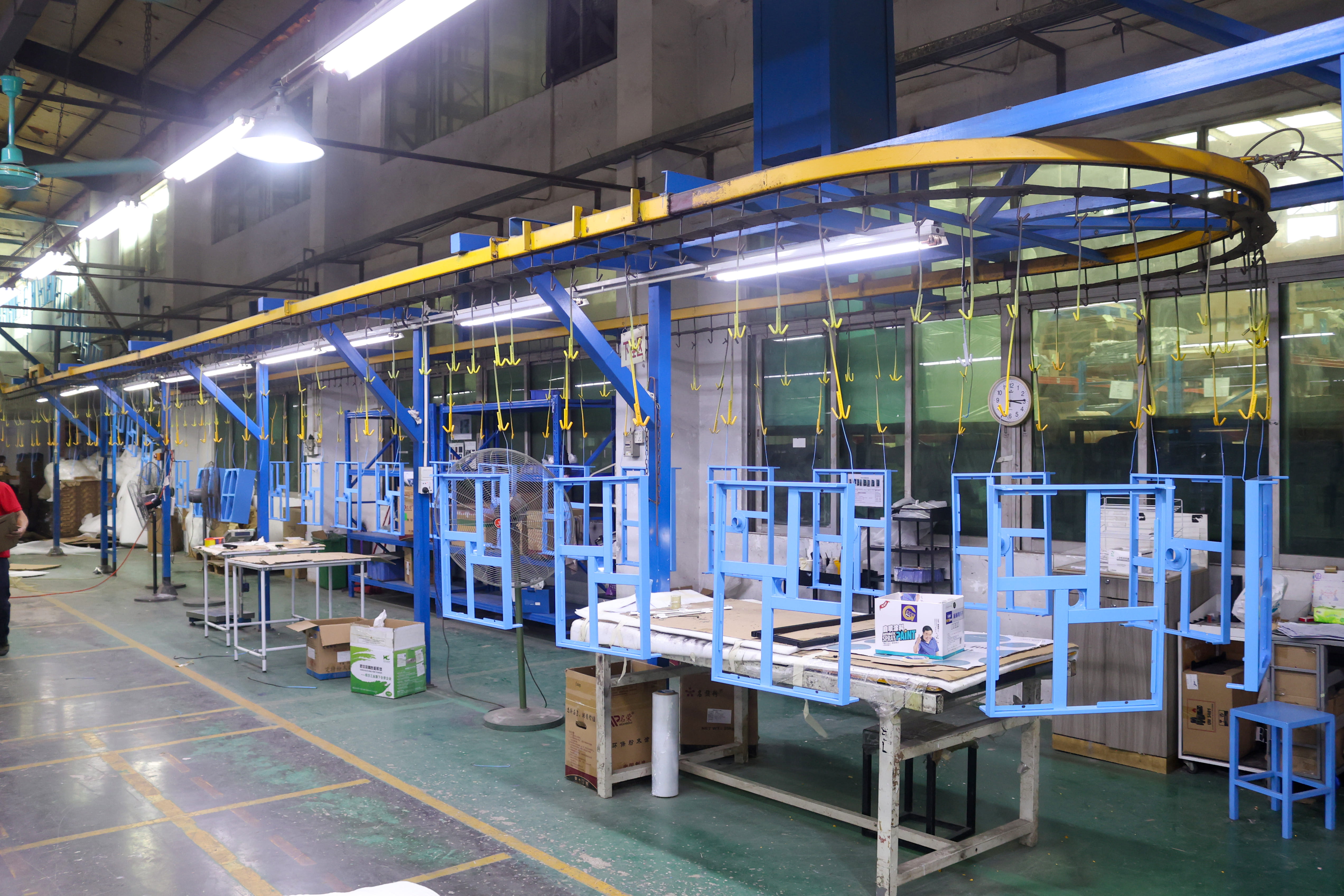 Powder coating unloading area for metal display fixtures
