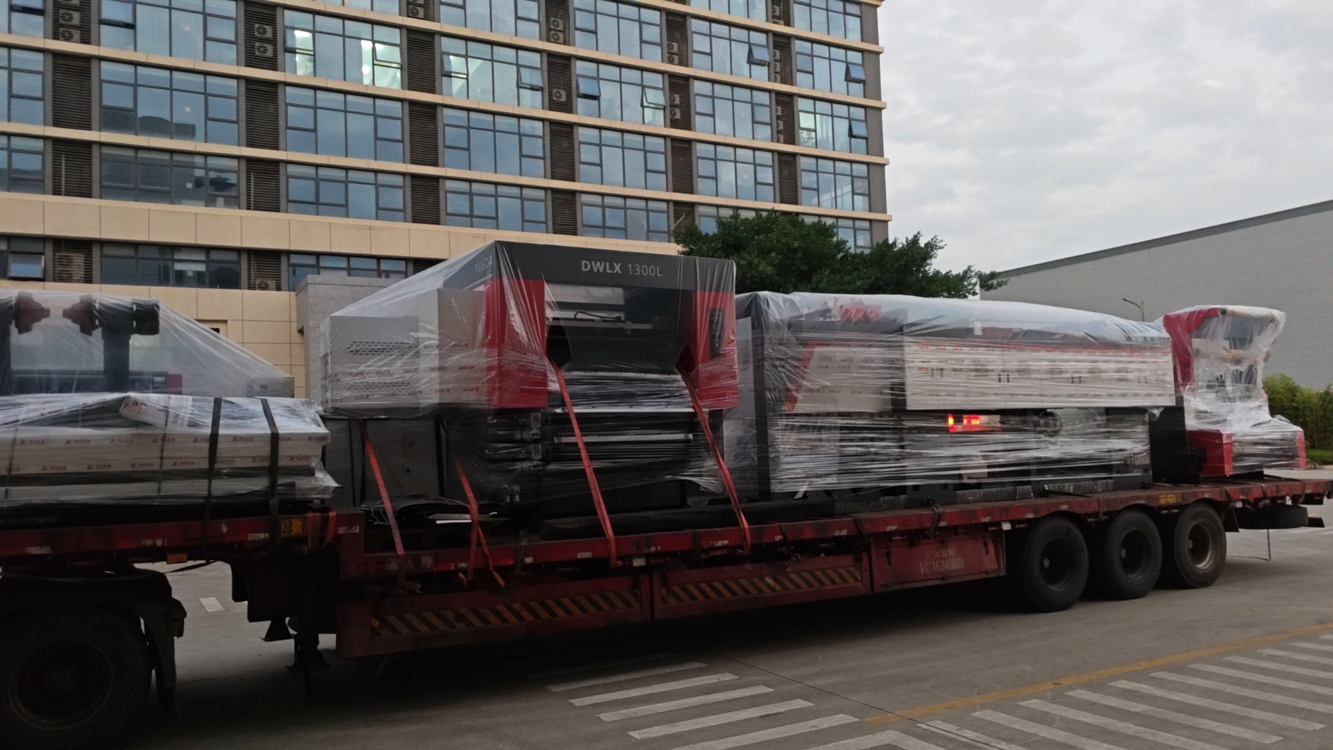 Large-scale coating and laminating machine fully wrapped and prepared for export shipment