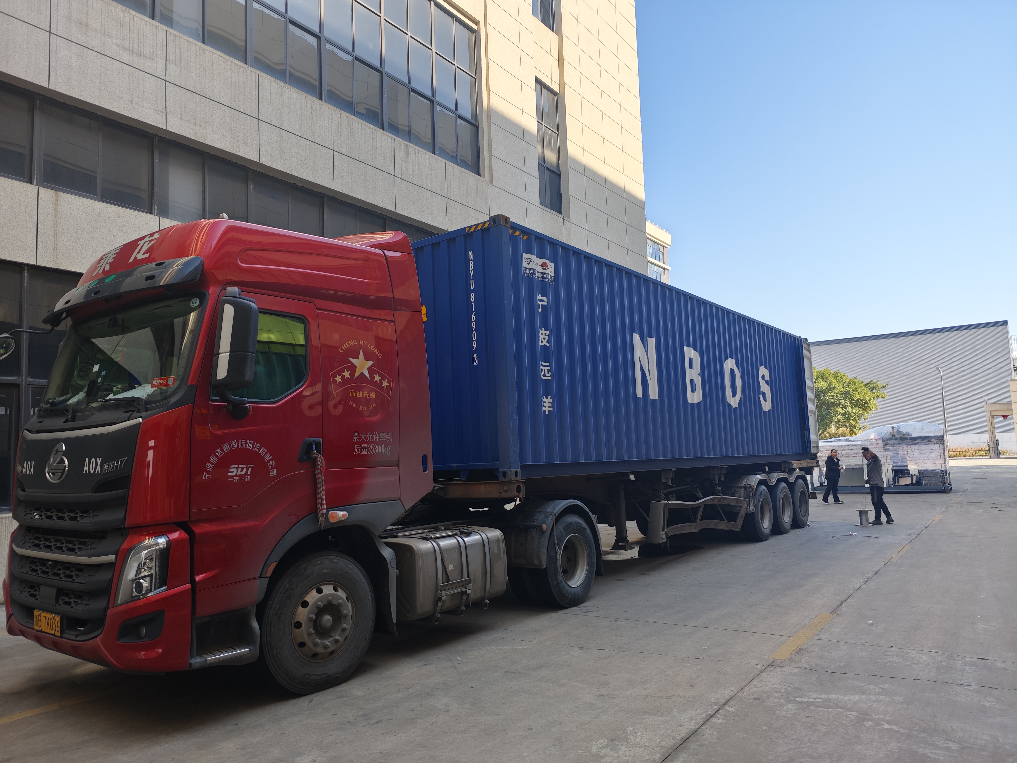 Container truck carrying YUEDA packaging machinery ready for international departure
