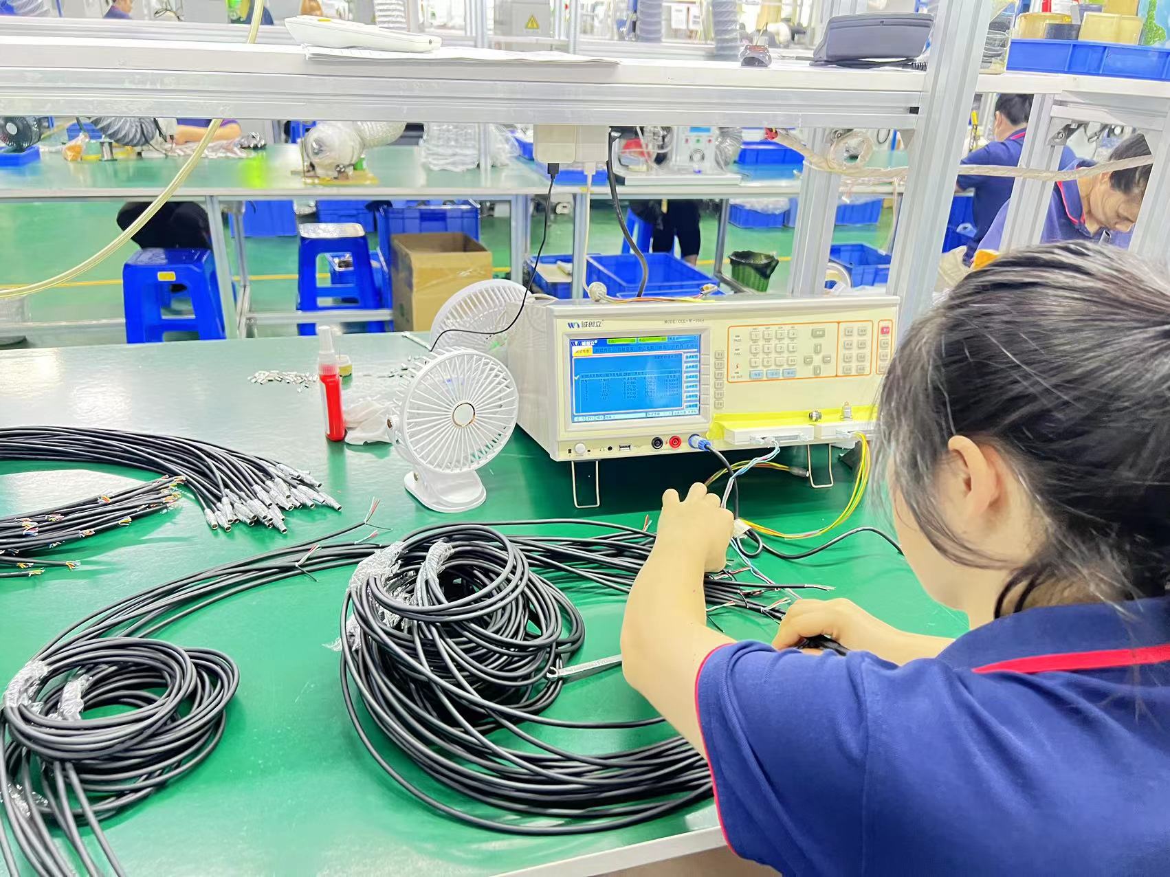 OQC 100% testing of push pull connectors at BEXKOM factory
