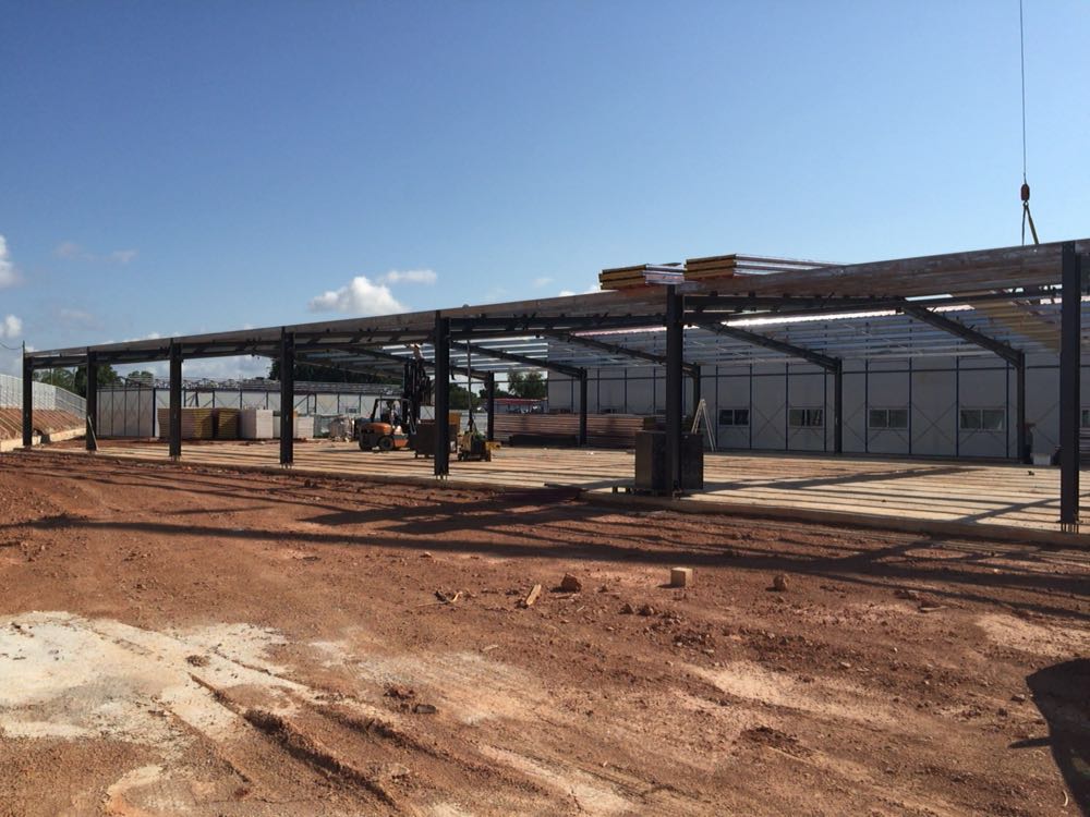 Prefabricated steel shed for labor camp side view