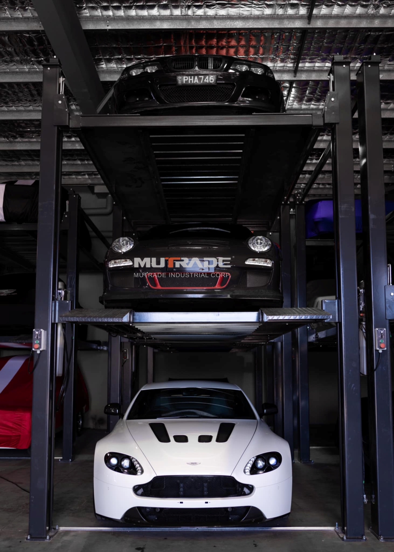 Hydro-Park 2525 4-post triple stacker in commercial car storage facility, tripling parking capacity vertically