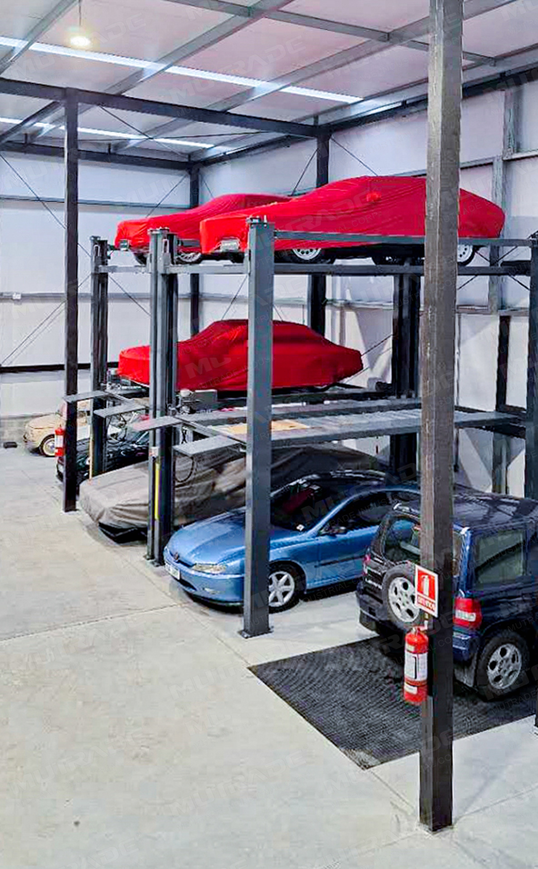 Hydro-Park 2525 triple stacker at auto shop in Uruguay