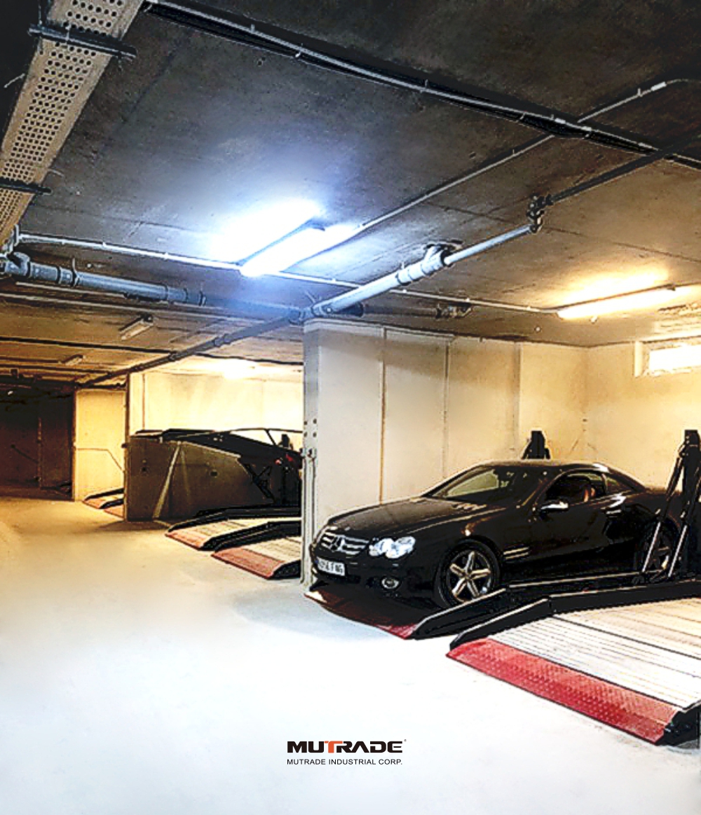 Tilting two-post parking lift installed in a low-ceiling residential underground car park