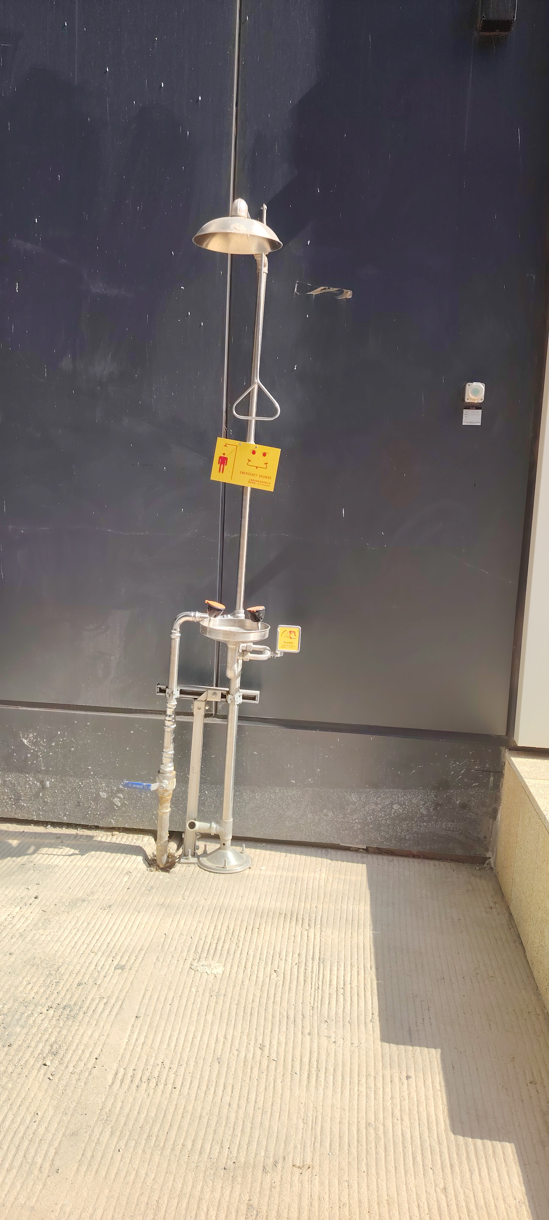 Industrial emergency shower and eyewash station installed in a chemical facility