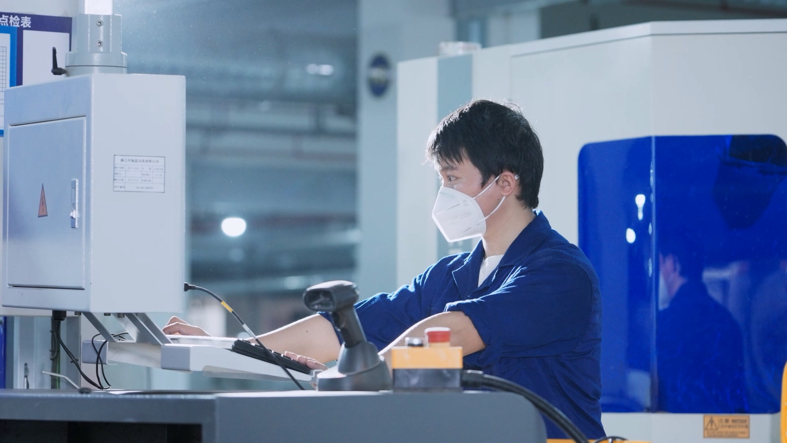 Workers operate the machines