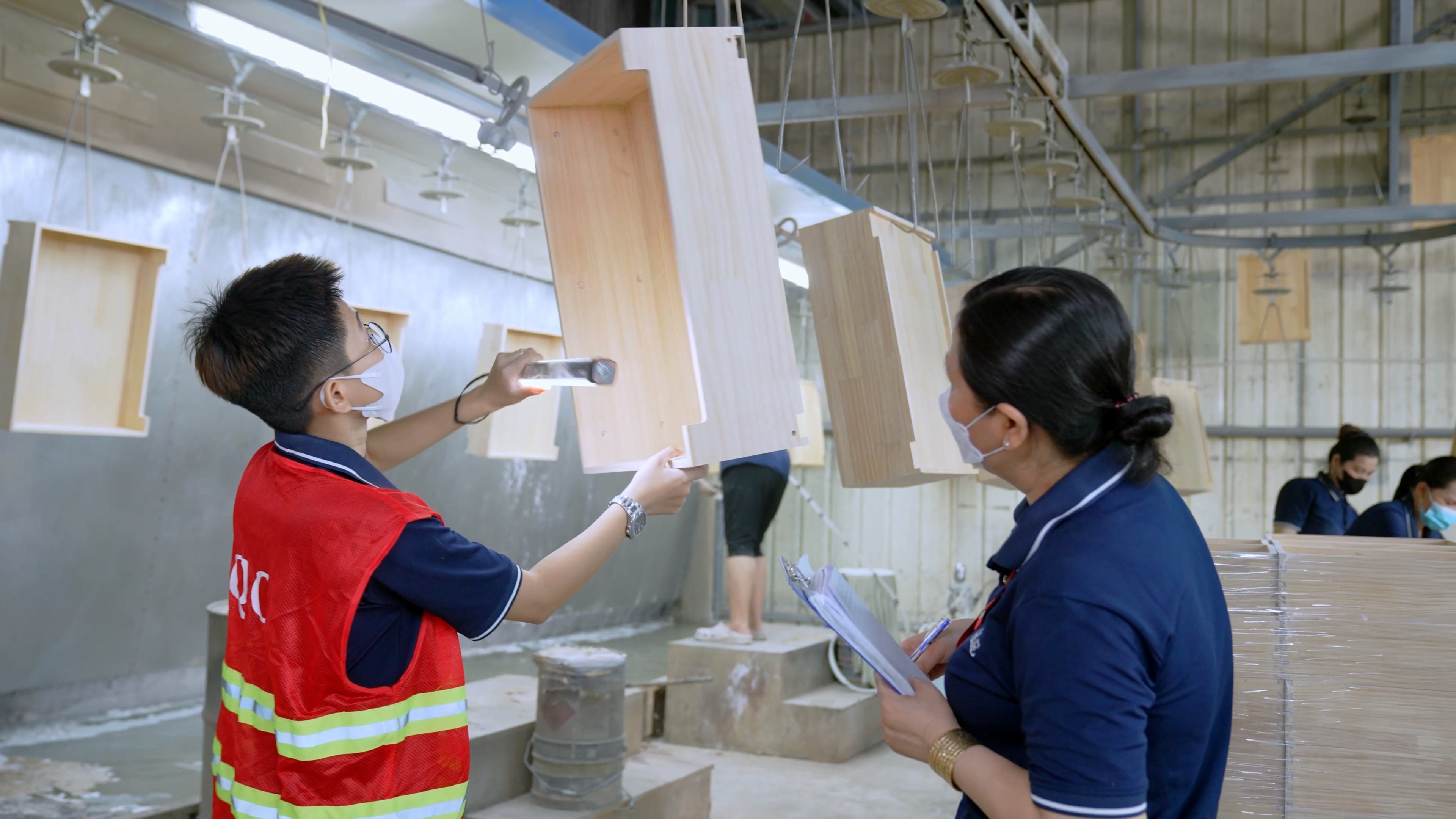 Quality inspector conducting tests in laboratory at Chinese shower door factory