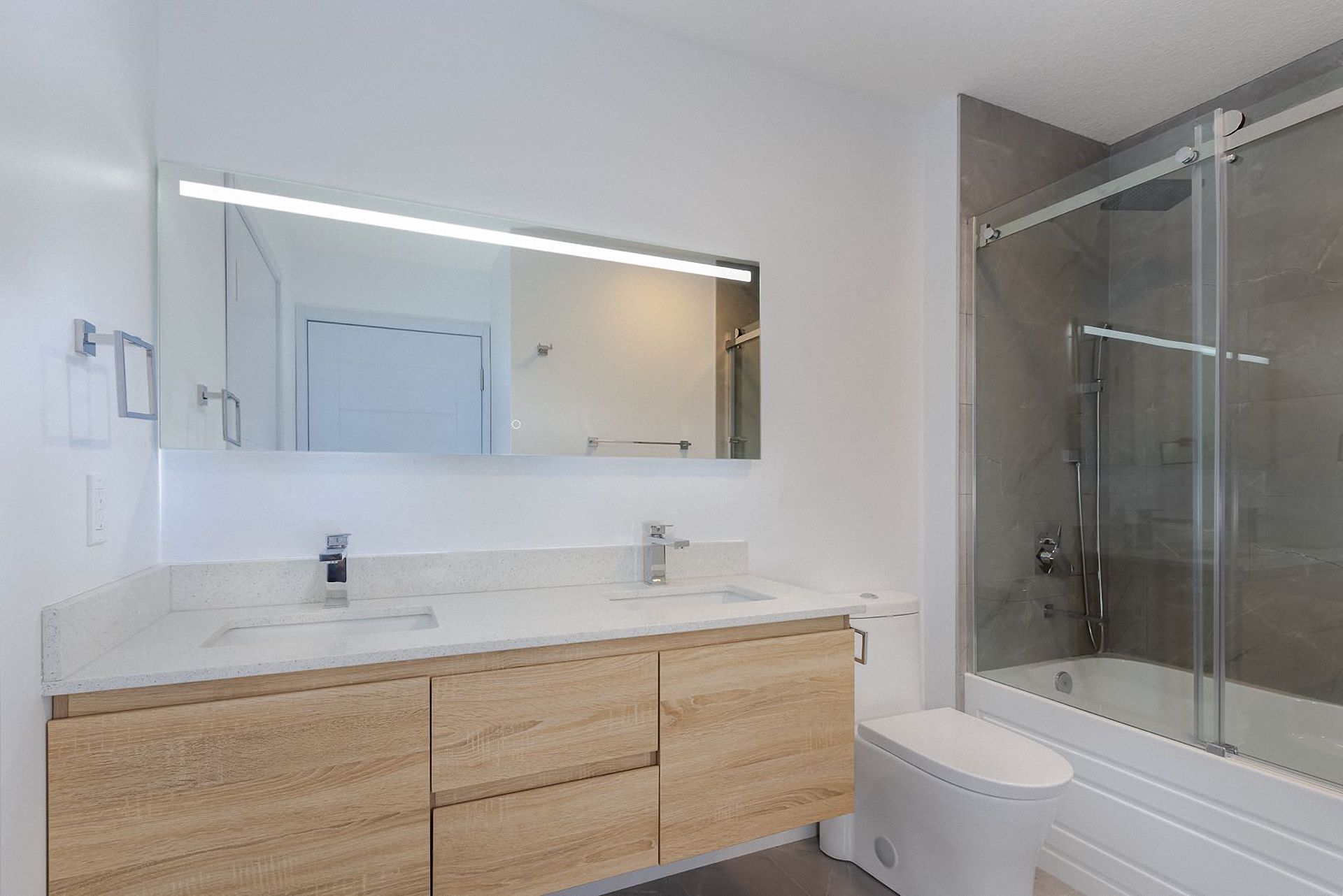 Bathroom vanity from a companion model series used in a coordinated bathroom package