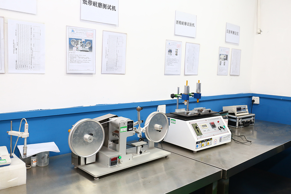 Alcohol abrasion testing machine used for quality control at Yongxin