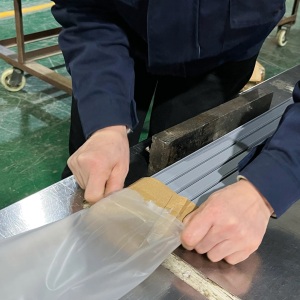 SIMBA factory worker packing glass shower door seal products