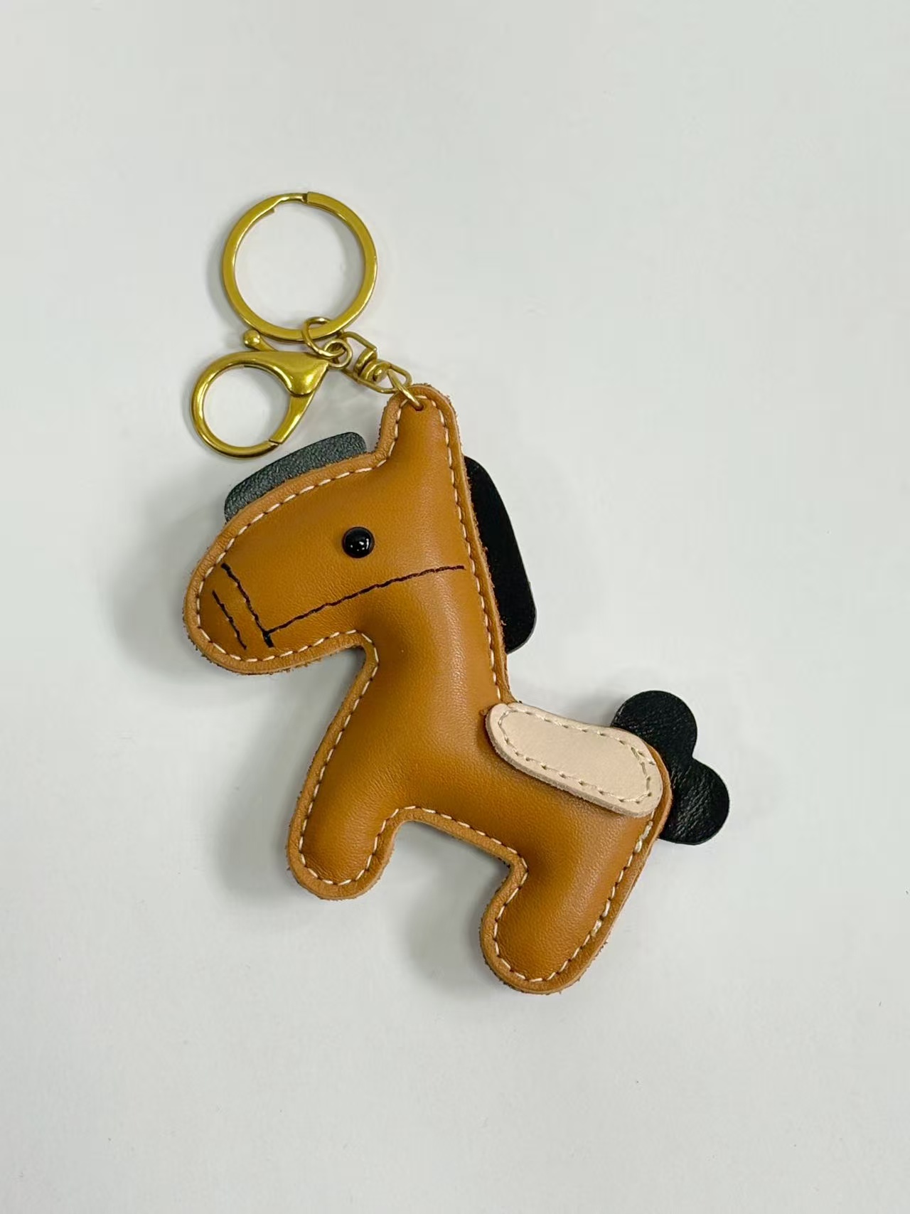 Custom leather keychain bag charm sample for wholesale inquiry