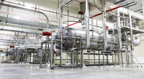 Factory equipment for non-dairy creamer production showing spray drying and blending system