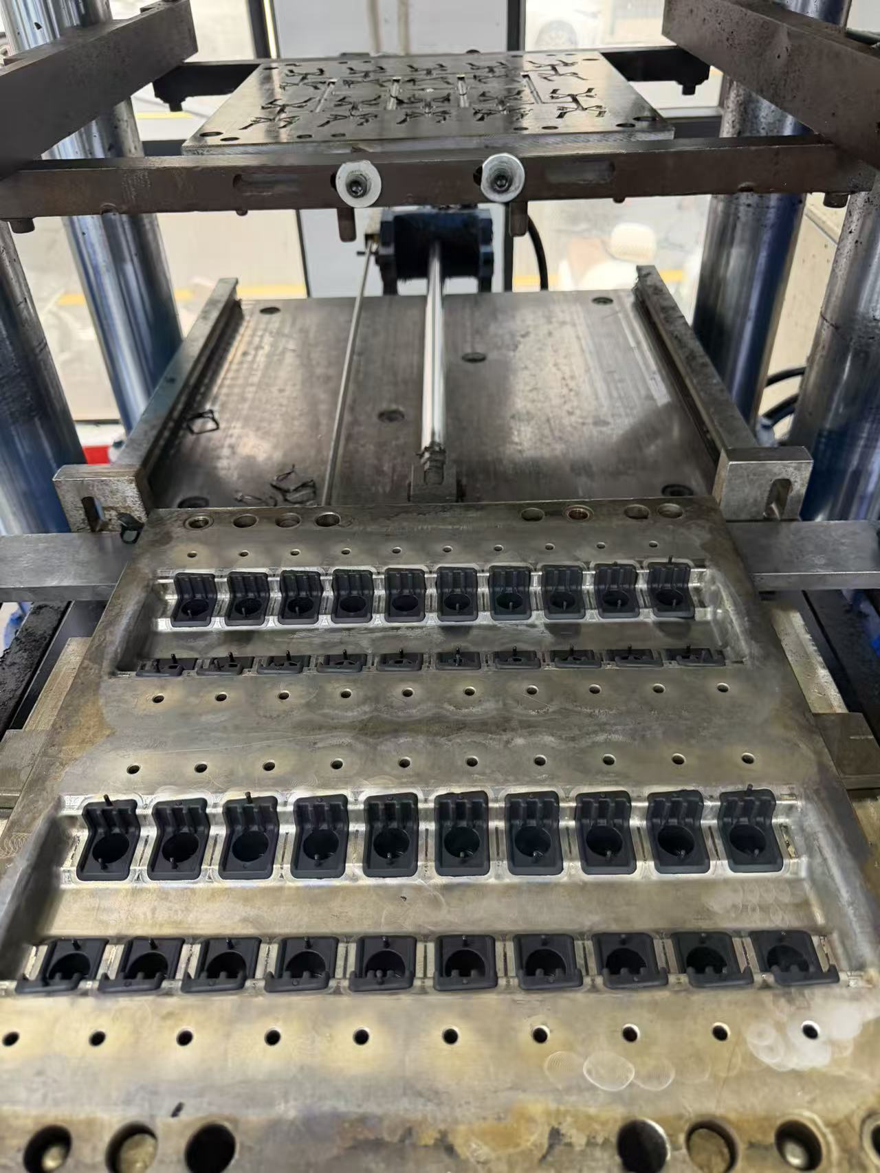 Custom molded rubber bonded to plastic parts produced for an automotive damper program