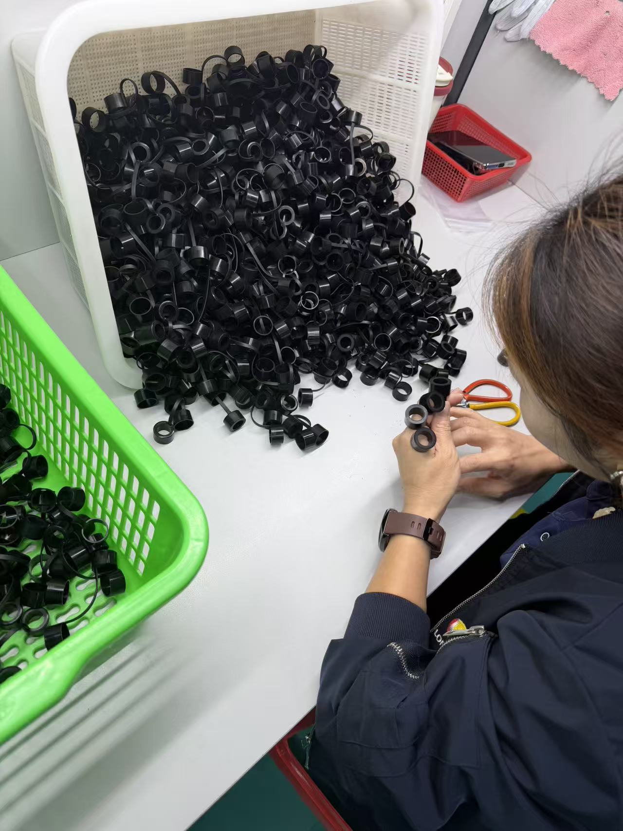 Rubber parts trimming process in a custom rubber molding workshop
