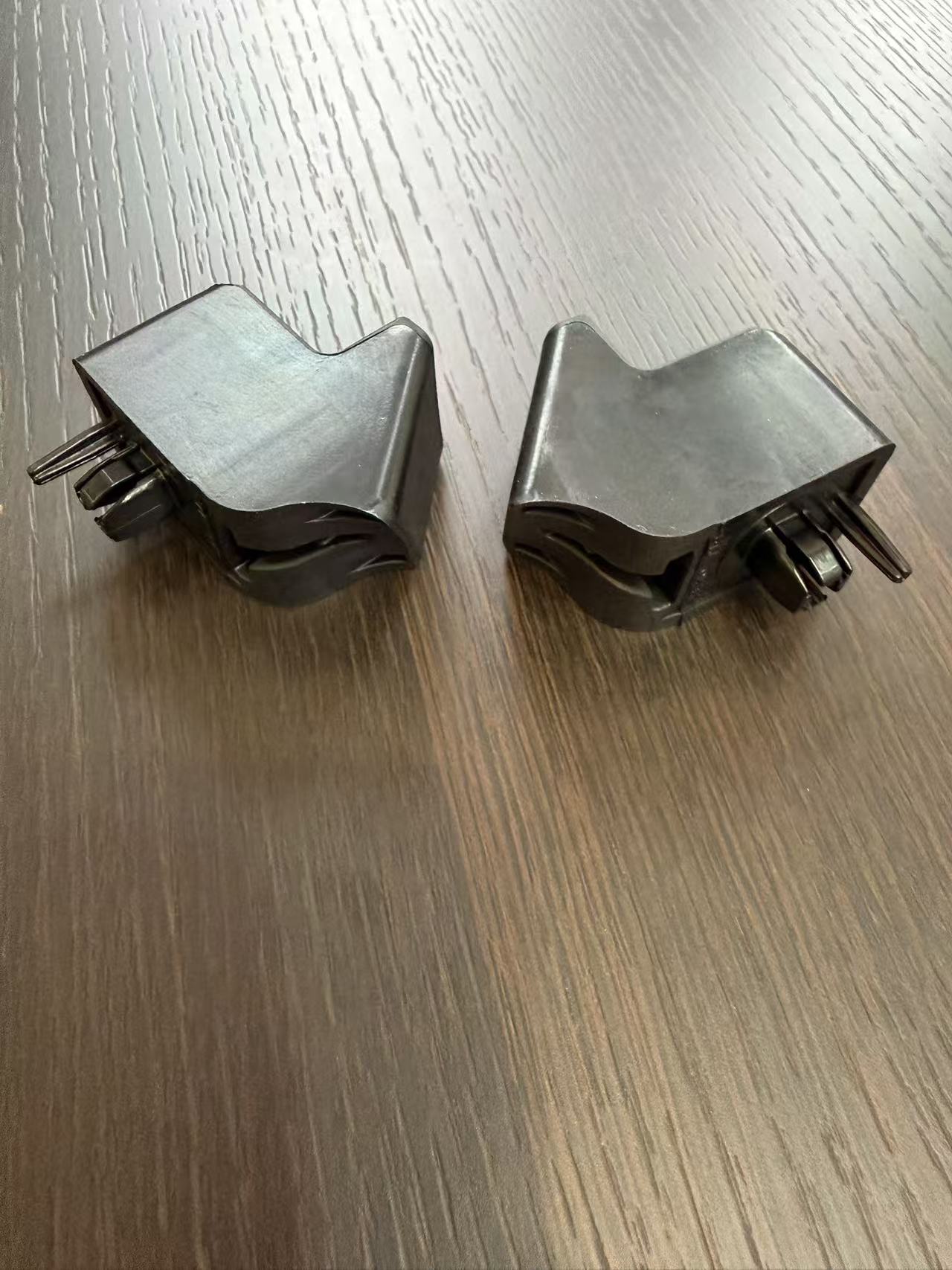 Rubber bonded plastic parts for automotive dampers