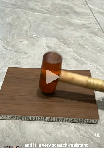 Hammer impact test on an aluminum honeycomb panel surface