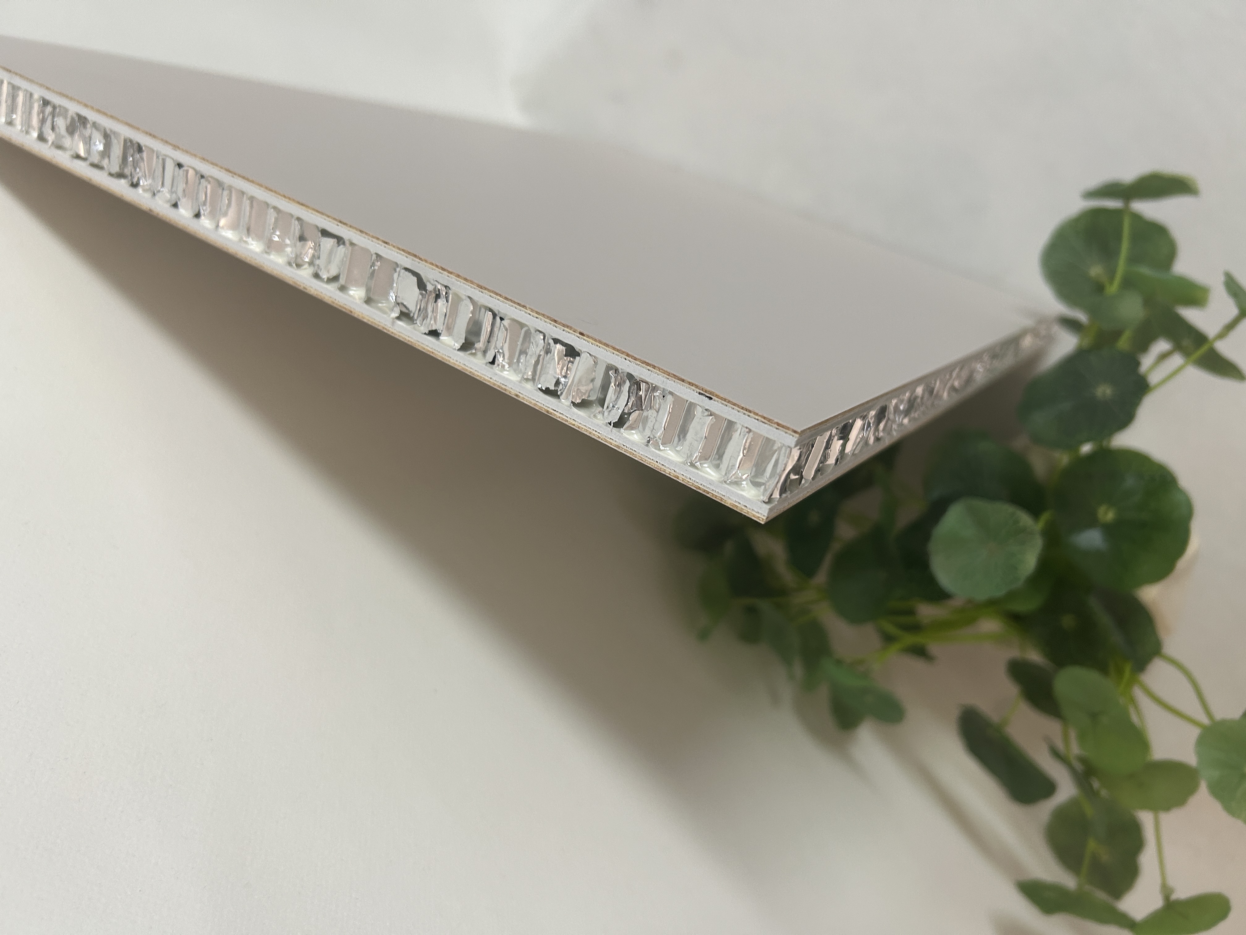 All-aluminum honeycomb panel display showing PETG and wood grain finishes