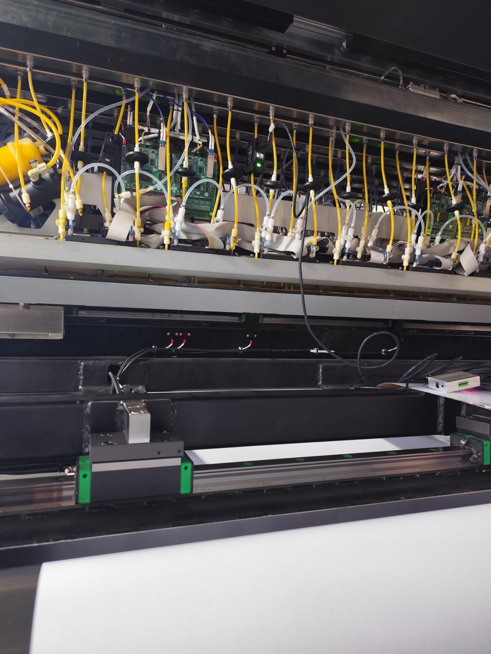 Clamp-on ultrasonic flow sensor installation in a printing process