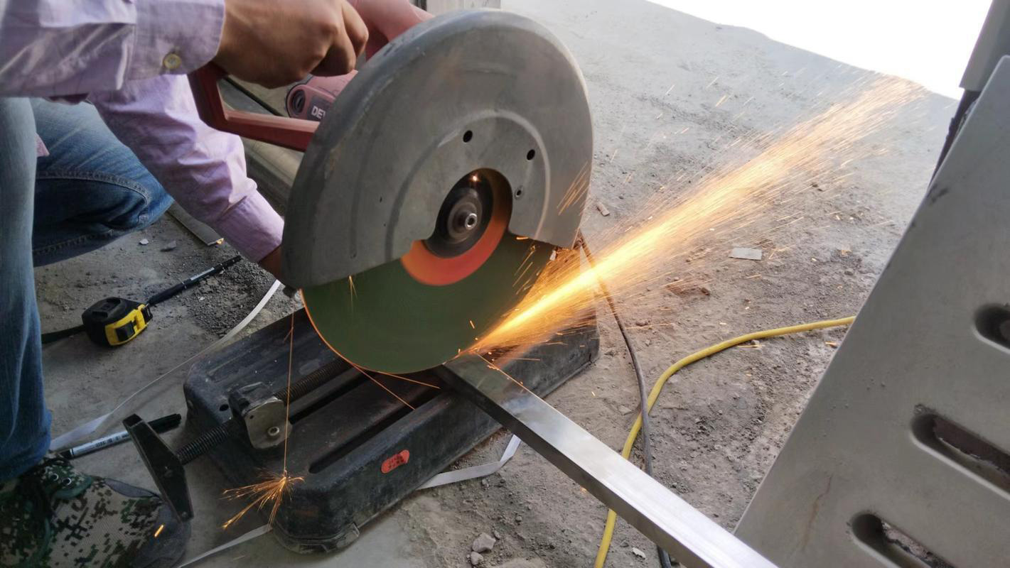 Stainless steel cutting operation using a reinforced cutting disc in an industrial setting