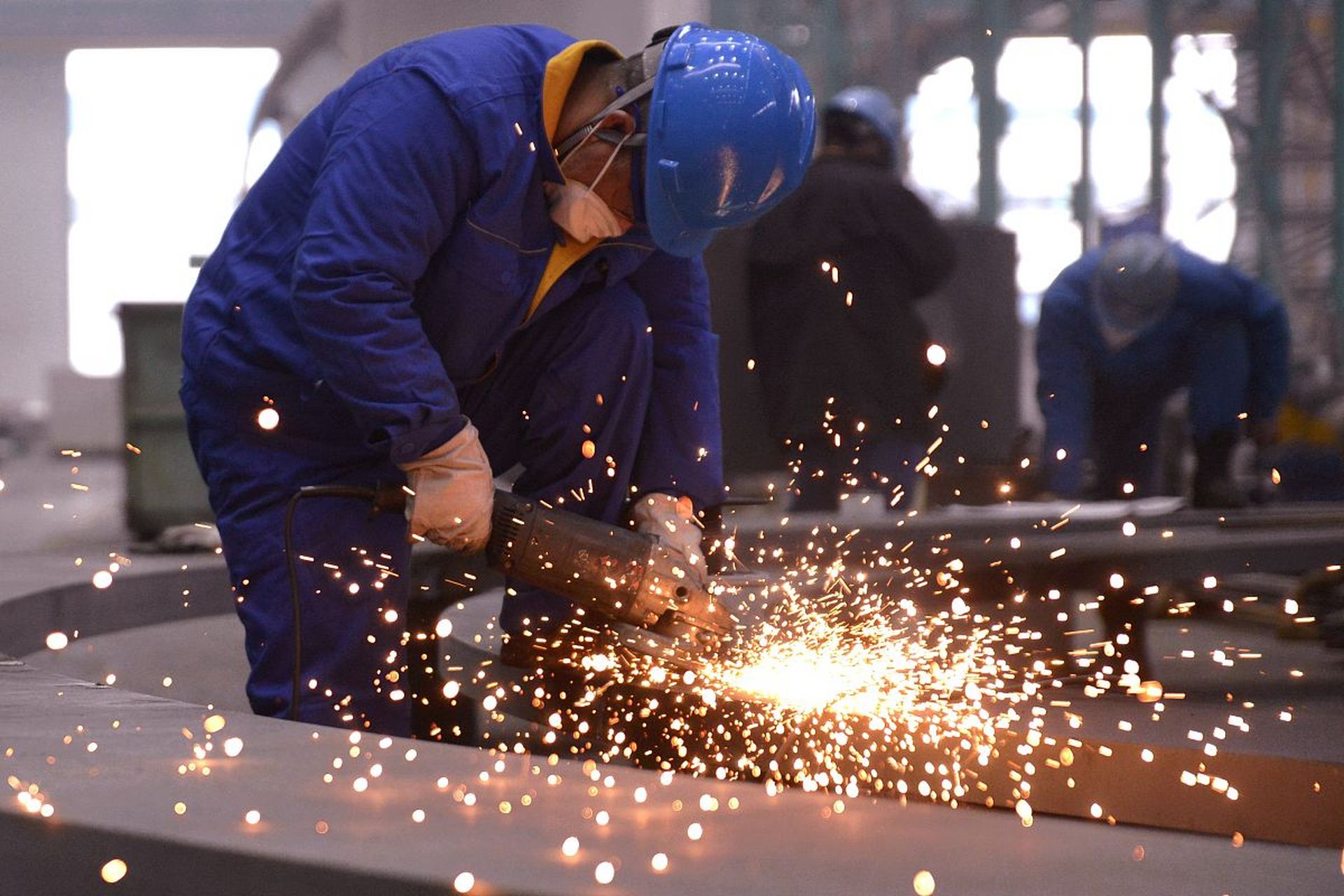 grinding wheel in use on steel pipe