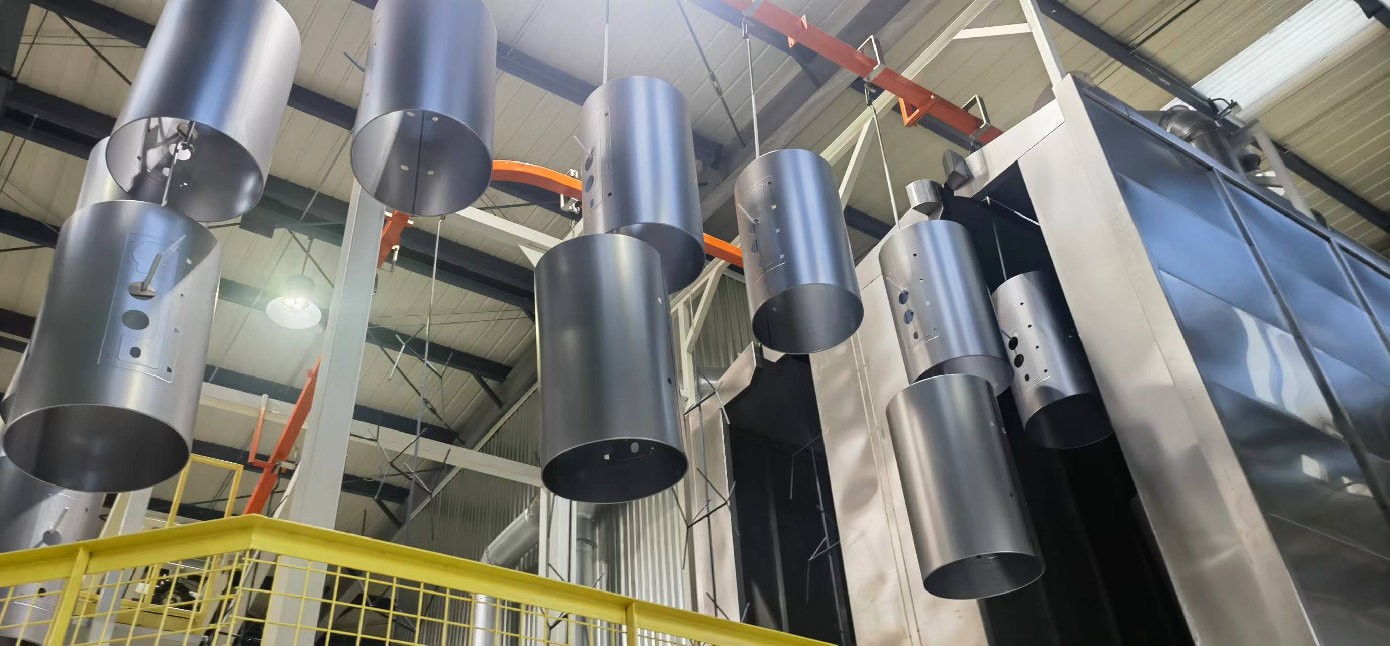 Water heater shell coating line demonstrating high-gloss finish