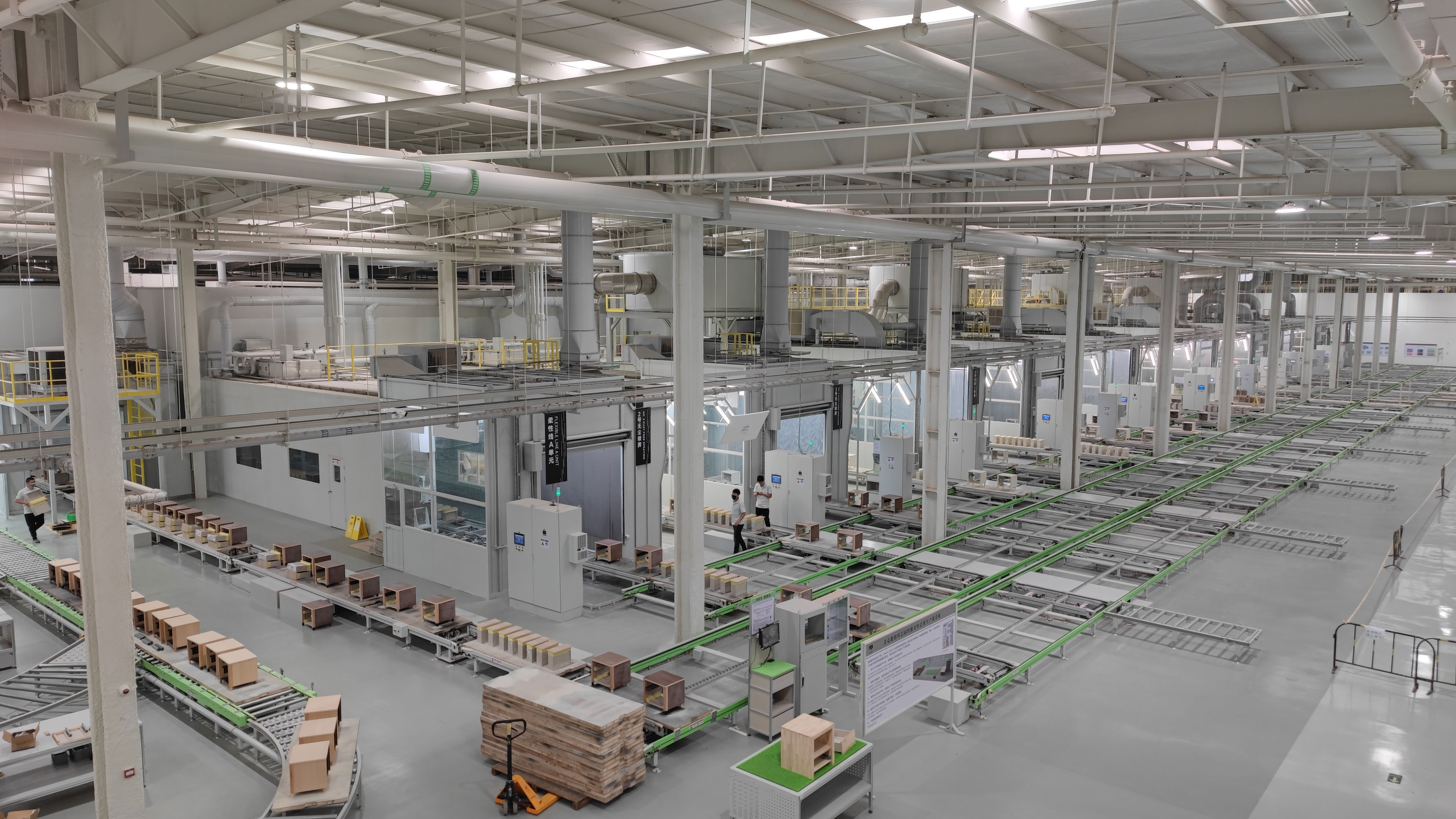 Wood furniture painting line with skid conveyor system
