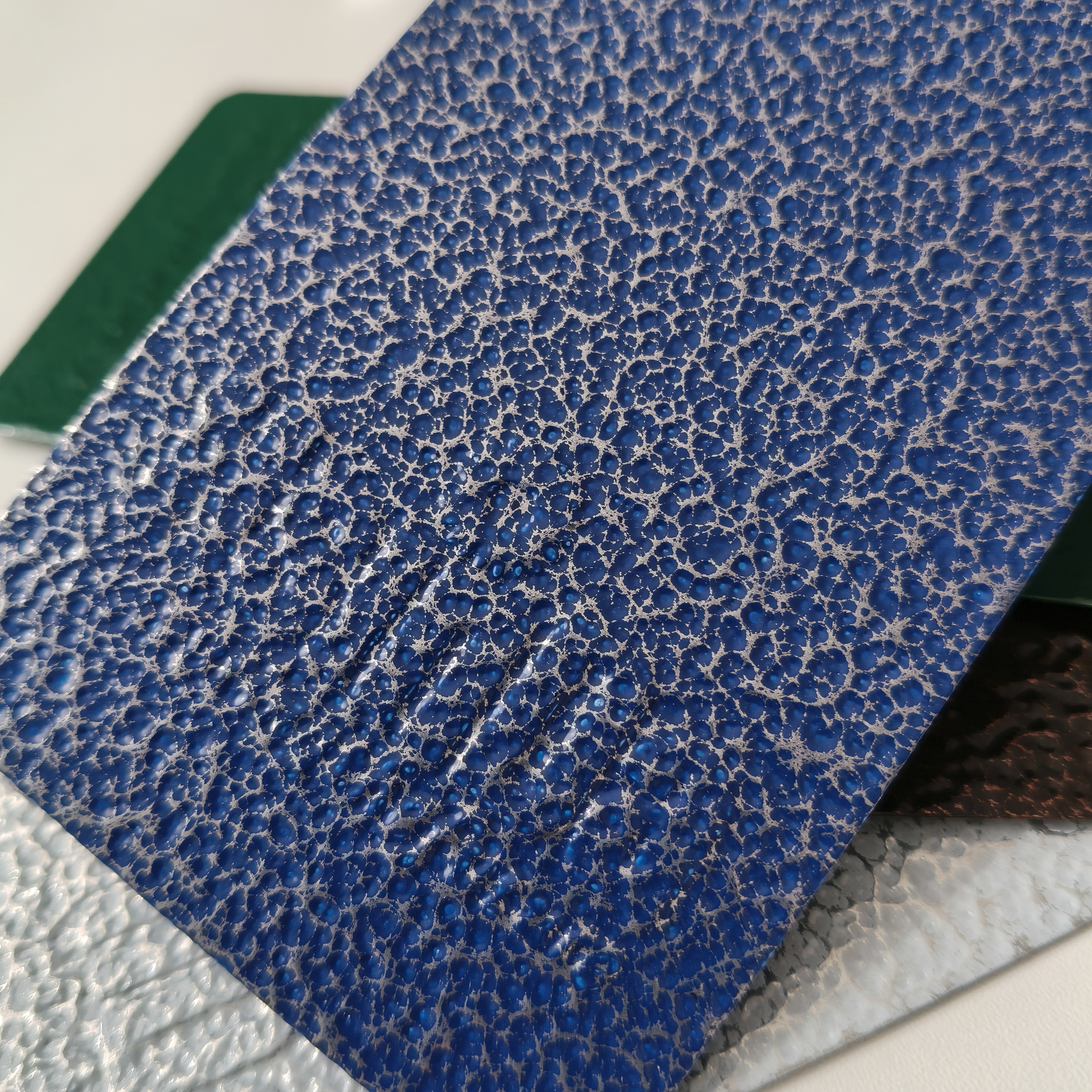 Hammer tone powder coating applied to architectural hardware and metal furniture parts