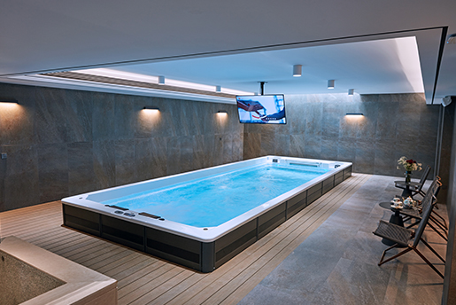 Basement installation of a Victoria Star Spa hot tub showing a finished residential wellness area
