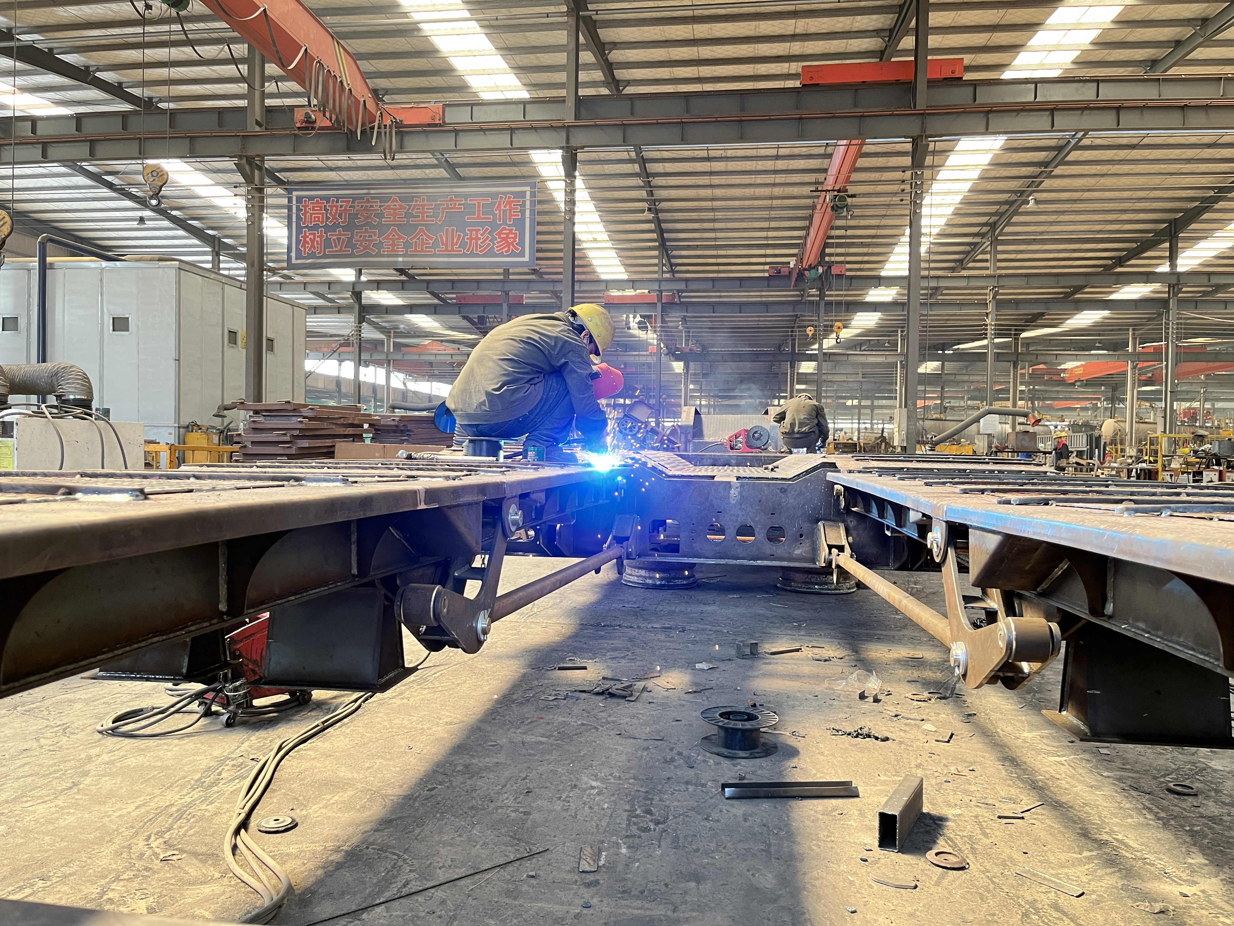 Heavy duty truck and semi-trailer manufacturing line operated by SHANDONG WONDERFUL AUTO COMPANY LIMITED