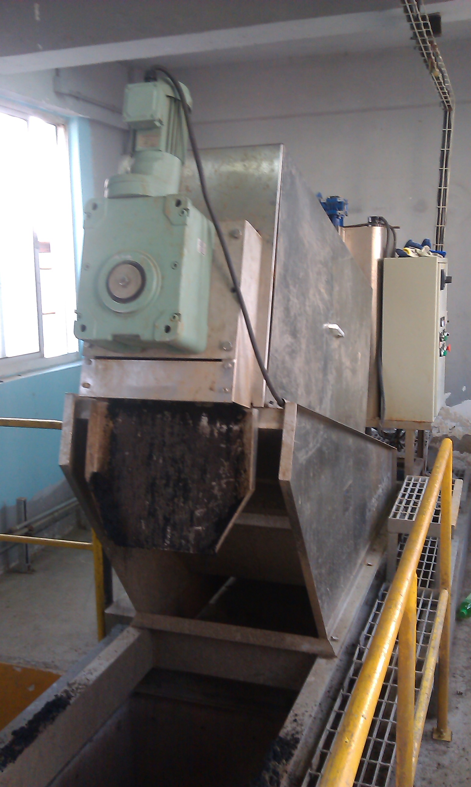 Screw press sludge dewatering equipment operating at a vegetable oil processing site
