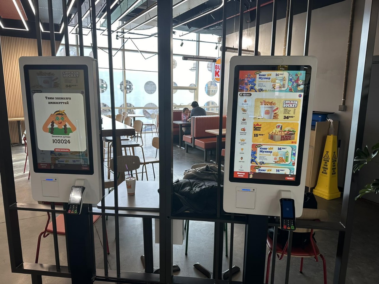 Self-ordering kiosk used in a quick-service restaurant