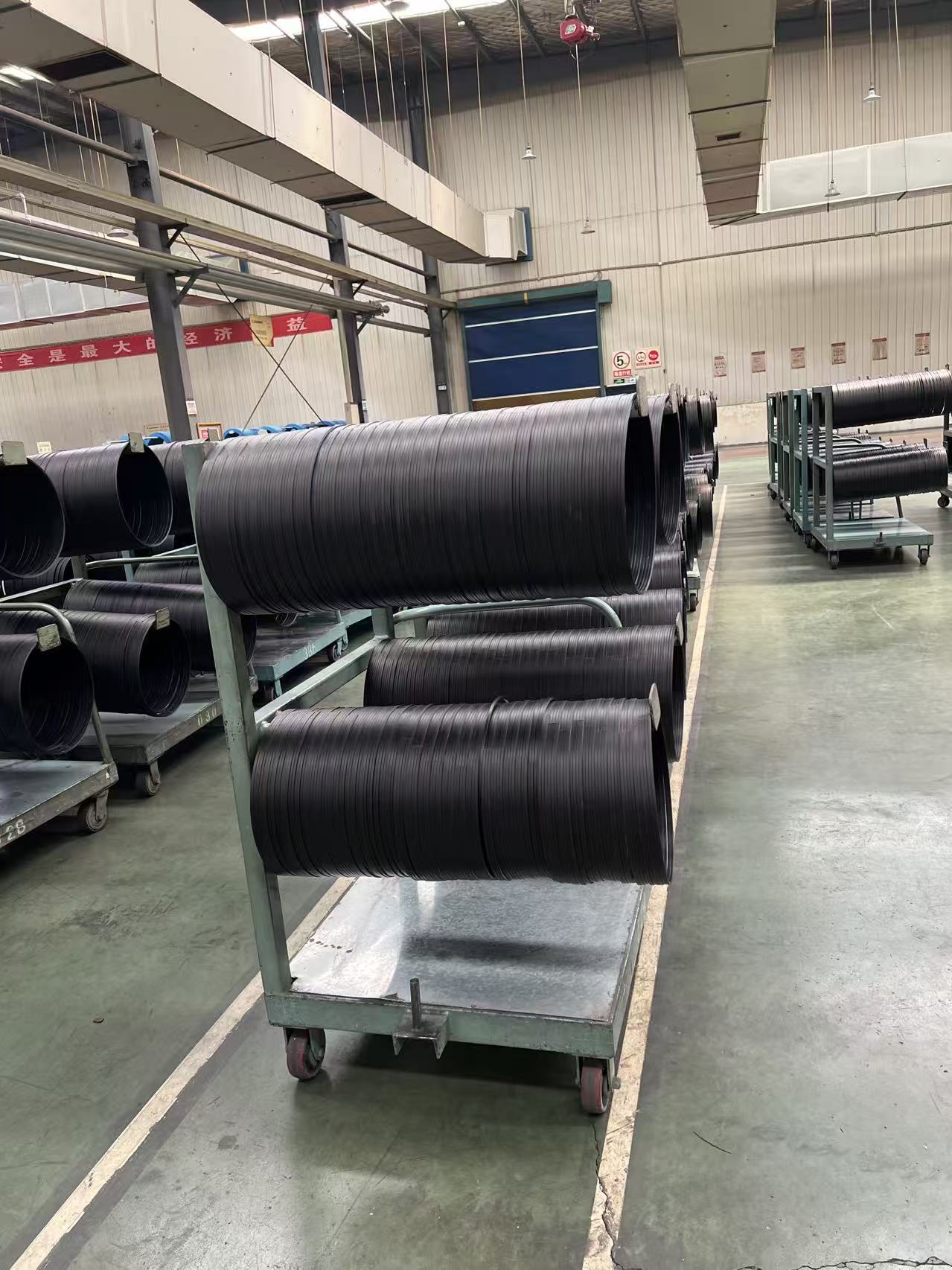 Steel sidewall reinforcement material used in off-road tire construction