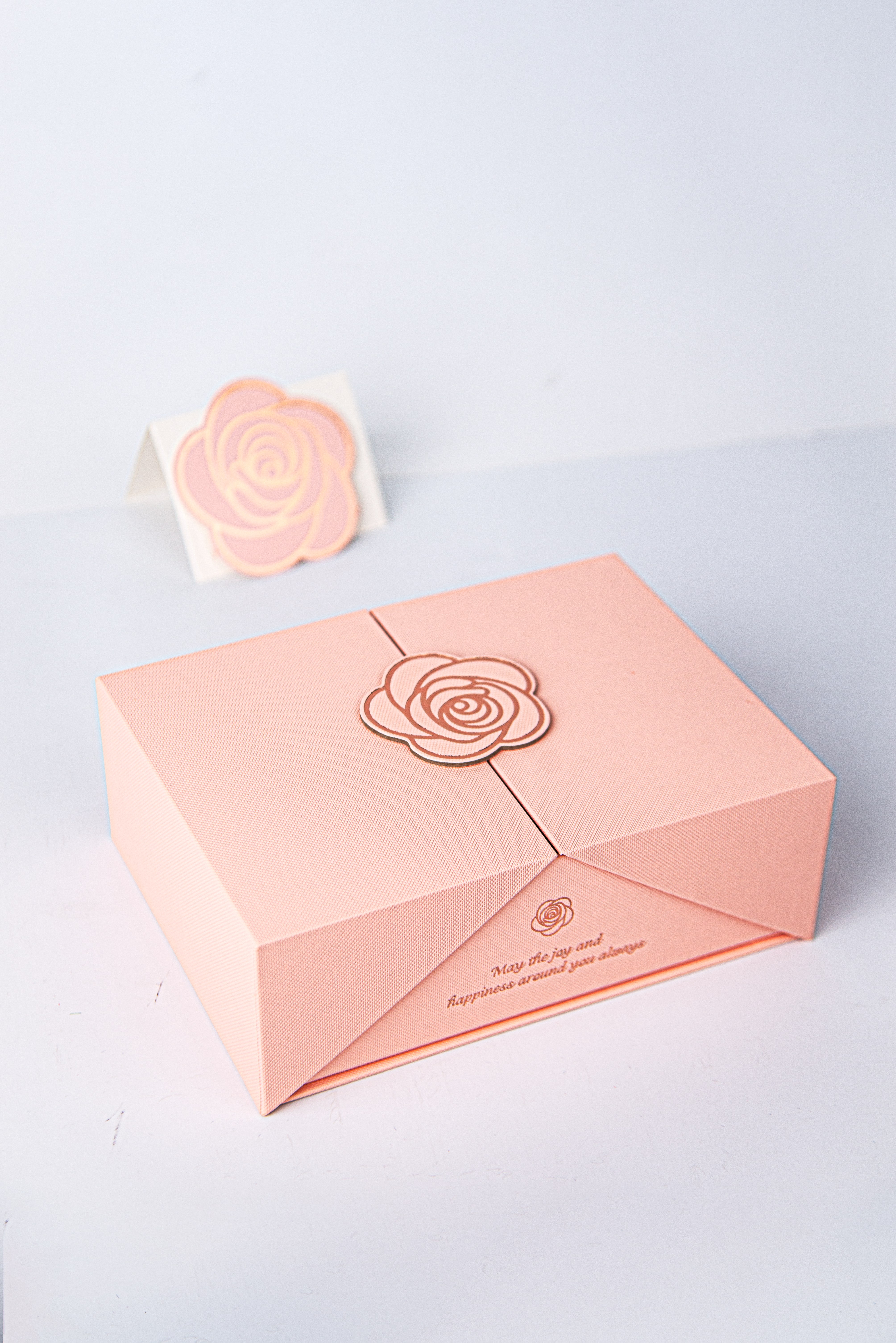 Custom rigid box with pink wrapping paper finish
