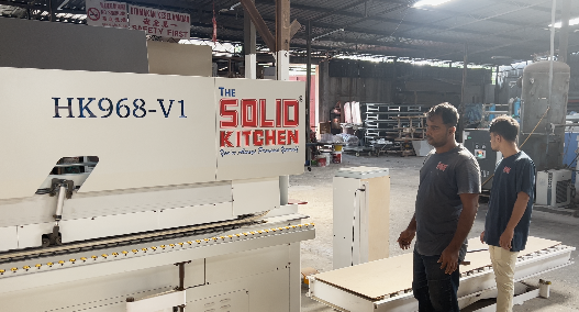 Automatic edge banding machine in operation at a Kenyan factory